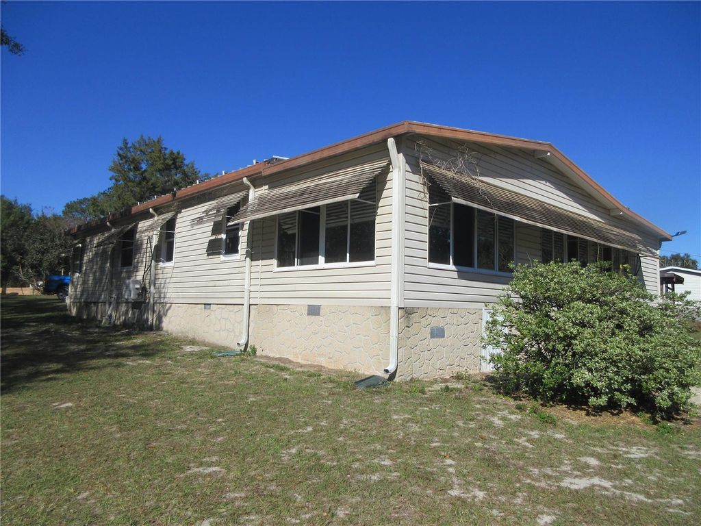 Photo of 1605 SE 160th Court, Ocklawaha, FL 32179 (MLS # OM715189)