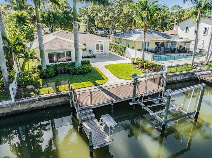 Embrace the Davis Islands Waterfront Lifestyle! Welcome to your home on Davis Islands, where the allure of island living meets modern comfort and convenience. This beautifully updated 3-bedroom, 2.5-bathroom abode is nestled on a serene and tranquil street along a deep water canal. A true waterfront gem, this residence invites you to bring your golf cart and boat, unlocking a world of possibilities within this vibrant community. As you step inside, you'll be greeted by an inviting open floor plan, adorned with rich hardwood floors that seamlessly guide you through the living spaces. Every inch of this home has been thoughtfully curated and meticulously updated, boasting modern bathrooms, an updated kitchen, and top-of-the-line stainless steel appliances. The kitchen serves as the heart of the home, where culinary creations and cherished memories come to life. The master bedroom is a sanctuary of tranquility, offering breathtaking waterfront views and an abundance of natural light that gently spills in. The two additional bedrooms are generously proportioned, creating a sense of spaciousness and comfort that defines this home's character. Evenings are best spent on the expansive travertine patio, where the setting sun casts a warm glow over the water. For boating enthusiasts, the sizable dock is a true highlight, complete with a 10,000 lb boat lift, a convenient filet table, and an additional slip for visiting guests. In addition to the waterfront perks, this property boasts an oversized, air-conditioned one-car garage, perfect for safeguarding your prized vehicle or providing ample storage space. Your outdoor spaces will remain immaculate, thanks to the included professional yard service provided by the owner. This worry-free feature adds to the ease of island living, allowing you to focus on enjoying all that Davis Islands has to offer. Unlock the doors to your Davis Islands dream home - where waterfront serenity and modern comfort unite. Don't miss your chance to experience this idyllic island lifestyle! **YARD/LANDSCAPE MAINTENANCE IS INCLUDED IN RENT**