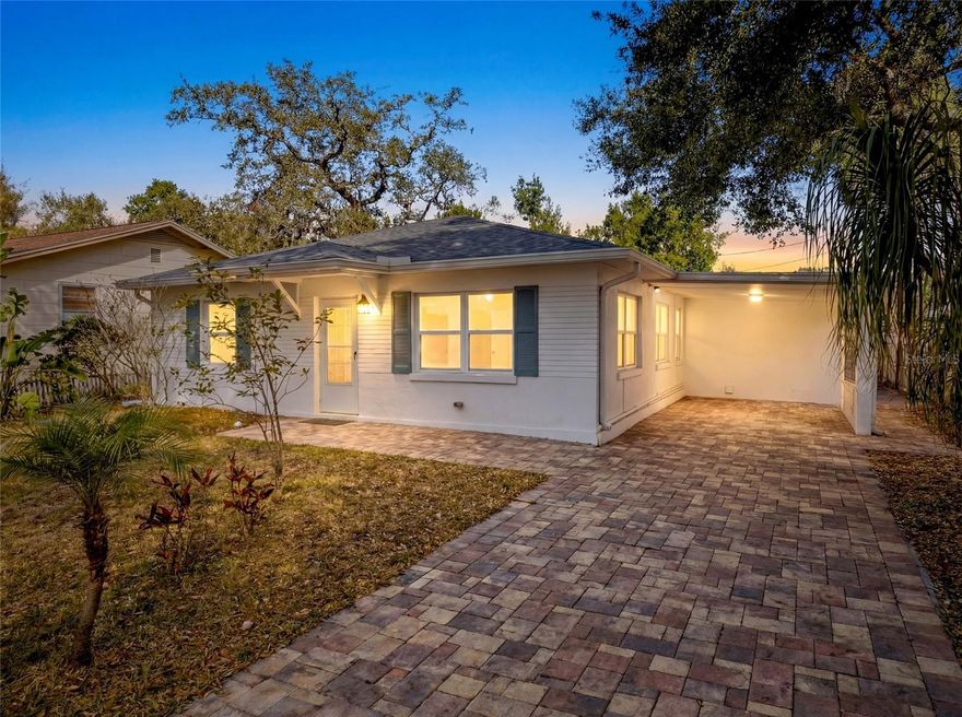 Delightful Dunedin at its finest.  It is now your opportunity to own this elegantly transformed home just a short golf cart ride to the gulf of America and/or delightful downtown Dunedin. Owned by an international artist, this home displays the style and tastefulness that typifies  coastal Florida lifestyle.  Enjoy our iconic winter months or live here all year round.  The home is up to date in every regard with a brand new roof in 2026, the a/c unit replaced in 2025, updated electrical panel and wiring, on-demand electric water heater, hurricane impact windows all around and impressive brick paver driveway and oversized rear deck, not to mention new interior and exterior paint.  Aside from the trouble free infrastructure of the home, the real artistry is in the finishes.  The updated functional kitchen boasts high quality shaker cabinets, quartz counters and stainless steel appliances.  Both bathrooms are updated as well.  The home has stylish and easily maintained luxury vinyl flooring throughout until you get to the heart of the home.  Beyond the kitchen, overlooking the private and shady backyard, is an inviting Florida room currently used as an art studio. Anyone can find their muse in this open functional space.  The second bathroom brilliantly shares flex space as a laundry and utility room.  Speaking of the backyard, you will spend endless evenings lounging and entertaining on your spacious brick deck enjoying the outdoor dining opportunities, fire pit and hot tub .  This home is a sparking Dunedin gem that you simply must see.  MOST of the elegant furnishing are available separately.  NO FLOOD ZONE.  NO DEED RESTRICTIONS.  NO HOA.  NO REASON NOT TO SEE THIS GREAT HOME TODAY.  Showing appointments are easily scheduled.