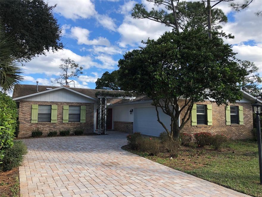 Lovingly maintained home w/ fantastic view in Prestigious Sugar Mill Country Club. This home overlooks the water and the greens of hole #7 on the White course.  Large patio and screen porches to enjoy the view.  Spacious kitchen with solid wood cabinetry and newer appliances, breakfast bar and dinette area.  Entry opens to the waterfront living room/dining area with tile floor, vaulted ceiling, gas fireplace and 2 sets of French doors to both the patio and screen porch.  Tile flooring throughout living area and kitchen.  Master bedroom features wood flooring, his and hers closets, custom cabinetry in bath with under cabinet lighting, towel bar warmer, tile walkin shower.  Guest bathroom features tub/tile shower and custom cabinetry.  3rd Bedroom/Office also has it's own bathroom and glass french doors.  2 car garage also has golf cart door entry.  Natural gas water heaters, cooktop, furnace and fireplace.  Many club memberships options available. ;Water: City