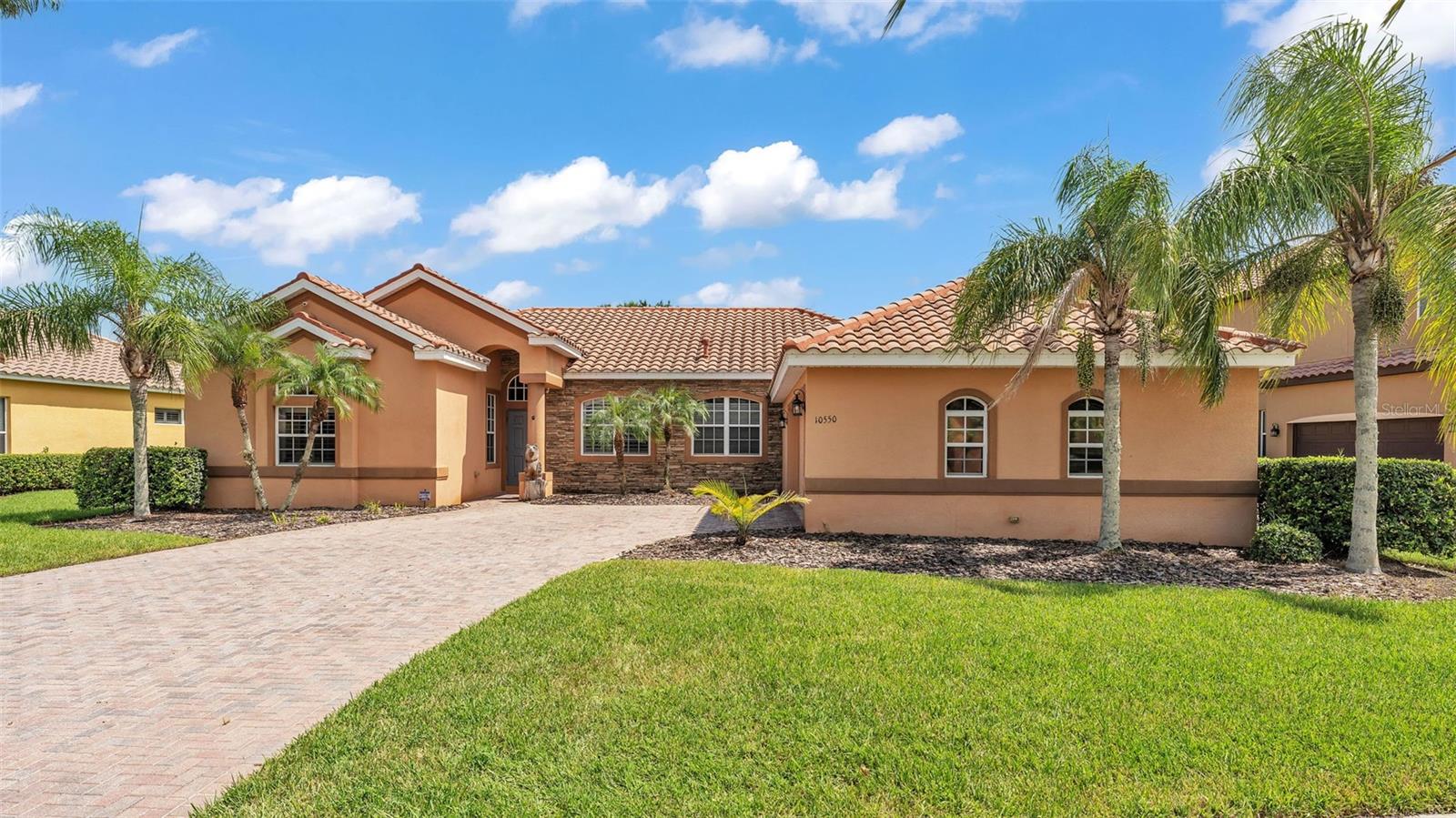 Welcome to your dream home in the highly desirable Cory Lake Isles! This immaculate 4-bedroom, 3-bath pool home offers a split floor plan with over 2,600 square feet of stylish, functional living space. From the moment you arrive, you’re greeted by a brick paver driveway and an oversized 2-car garage. Inside, the open layout features ceramic tile flooring, a formal dining room, and a spacious living area that flows seamlessly into the gourmet kitchen—complete with cherry wood cabinets, granite countertops, stainless steel appliances, and a built-in desk area. The breakfast nook boasts panoramic views of your screened-in pool and heated spa, creating the perfect indoor-outdoor lifestyle.
The oversized family room is prewired for surround sound and has cascading sliders that open fully to bring the outside in. The primary suite is a true retreat with a soaking jacuzzi tub, separate shower, dual vanities, and a walk-in closet. A private guest bedroom with its own bath and pool access is perfect for visitors or multigenerational living. Don’t miss the flex room with French doors—ideal for a home office, gym, or playroom.
Located in a gated, resort-style community with access to a clubhouse, fitness center, tennis courts, and 165-acre lake, this home is minutes from I-75, I-4, USF, hospitals, and all of Tampa’s best shopping and dining. Low HOA. Homes like this in Cory Lake Isles rarely last—schedule your tour today!