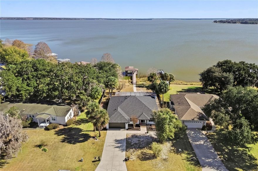 LIVE THE FLORIDA DREAM IN THIS BEAUTIFUL LAKEFRONT HOME!

Located in a quiet pocket community of just 15 homes in Leesburg, this 4-bedroom, 2-bathroom lakefront property offers privacy, direct water access, and stunning open views of Lake Yale. A brand new roof was installed in late 2023, providing added value and peace of mind.

Inside, you’ll find a spacious great room with vaulted ceilings, luxury vinyl plank flooring, and beautiful lake views. Large windows and sliding glass doors allow for abundant natural light throughout the home.

The open kitchen features granite countertops, ample cabinet and counter space, wrap-around breakfast bar seating, and a convenient pass-through to the formal dining room. The dishwasher, microwave, and garbage disposal are all new. The dining area includes crown molding and chair rail detailing, making it ideal for everyday living or entertaining.

This single-story home offers a split-bedroom layout for added privacy. The primary suite includes lake views, private sliding door access to the screened lanai, a garden tub, walk-in shower, and dual sinks. Two additional bedrooms are located on the opposite side of the home and share access to the second full bathroom. A separate flex space near the front of the home is perfect for a home office, den, or additional sitting area. One guest bedroom also features private lanai access and lake views.

The AC system and water heater are approximately 10–15 years old and have been professionally serviced annually, with an upcoming service appointment already scheduled. The home is also wired for a generator, providing added convenience and peace of mind during storm season.

Outdoor living is a highlight, featuring a large screened lanai overlooking the landscaped backyard and waterfront. Enjoy direct access to skiable Lake Yale with your private boat dock and boathouse. Additional features include side parking for a boat, a storage shed, and access to a community boat ramp.

Lake Yale is a 4,000-acre sandy-bottom lake known for boating, watersports, and excellent fishing, including largemouth bass, black crappie, bluegill, catfish, and chain pickerel. Seaplanes are also known to land on the lake, adding to its unique waterfront charm.

Conveniently located approximately 15 minutes from Eustis and Mount Dora and about 20 minutes from Leesburg shopping, dining, and entertainment.

Don’t miss this opportunity to own a true lakefront property in Lake County.