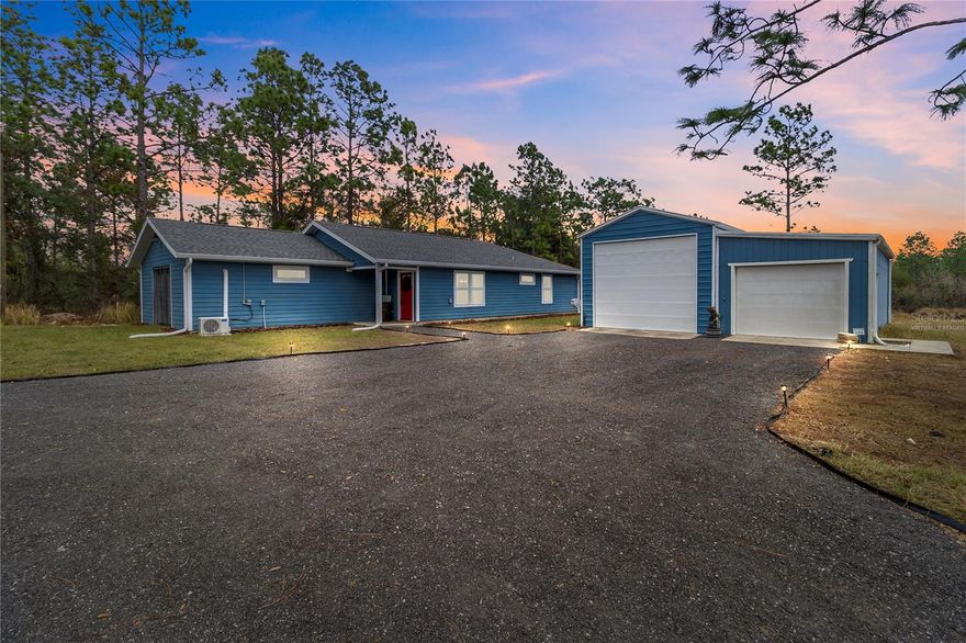 One or more photo(s) has been virtually staged. Welcome to this like-new 3-bedroom, 2-bath home nestled on a beautifully cleared 1.34-acre lot in the peaceful University Oaks subdivision. This turn-key, move-in-ready property offers comfort, flexibility, and room to grow—perfect for homeowners seeking space and freedom. Another plus- FIBER internet! 

A standout feature is the impressive 1,000 sq. ft. detached garage with double doors, including one 12-ft high entry ideal for RVs, boats, or large equipment, and a second 8-ft door for everyday use. Whether you need a workshop, storage, or future expansion space, the possibilities are truly endless on this oversized lot.

Located in Levy County, you’ll enjoy the benefit of lower property taxes and no HOA, giving you the freedom to use your land your way. Fiber-optic internet is available—perfect for remote workers.

Conveniently situated just minutes from Gainesville, this property offers the best of both worlds: peaceful rural living with quick access to city amenities. Don’t miss out on this exceptional opportunity to own a modern home with land, flexibility, and unmatched value.