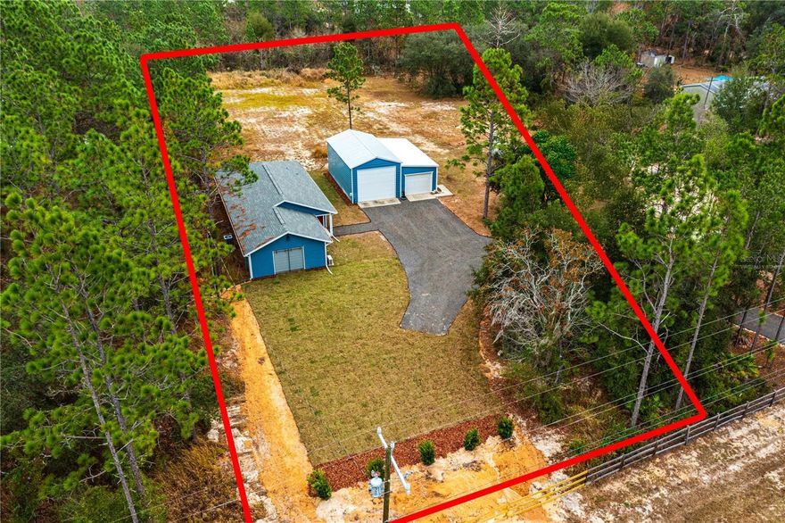 One or more photo(s) has been virtually staged. Welcome to this like-new 3-bedroom, 2-bath home nestled on a beautifully cleared 1.34-acre lot in the peaceful University Oaks subdivision. This turn-key, move-in-ready property offers comfort, flexibility, and room to grow—perfect for homeowners seeking space and freedom. Another plus- FIBER internet! 

A standout feature is the impressive 1,000 sq. ft. detached garage with double doors, including one 12-ft high entry ideal for RVs, boats, or large equipment, and a second 8-ft door for everyday use. Whether you need a workshop, storage, or future expansion space, the possibilities are truly endless on this oversized lot.

Located in Levy County, you’ll enjoy the benefit of lower property taxes and no HOA, giving you the freedom to use your land your way. Fiber-optic internet is available—perfect for remote workers.

Conveniently situated just minutes from Gainesville, this property offers the best of both worlds: peaceful rural living with quick access to city amenities. Don’t miss out on this exceptional opportunity to own a modern home with land, flexibility, and unmatched value.