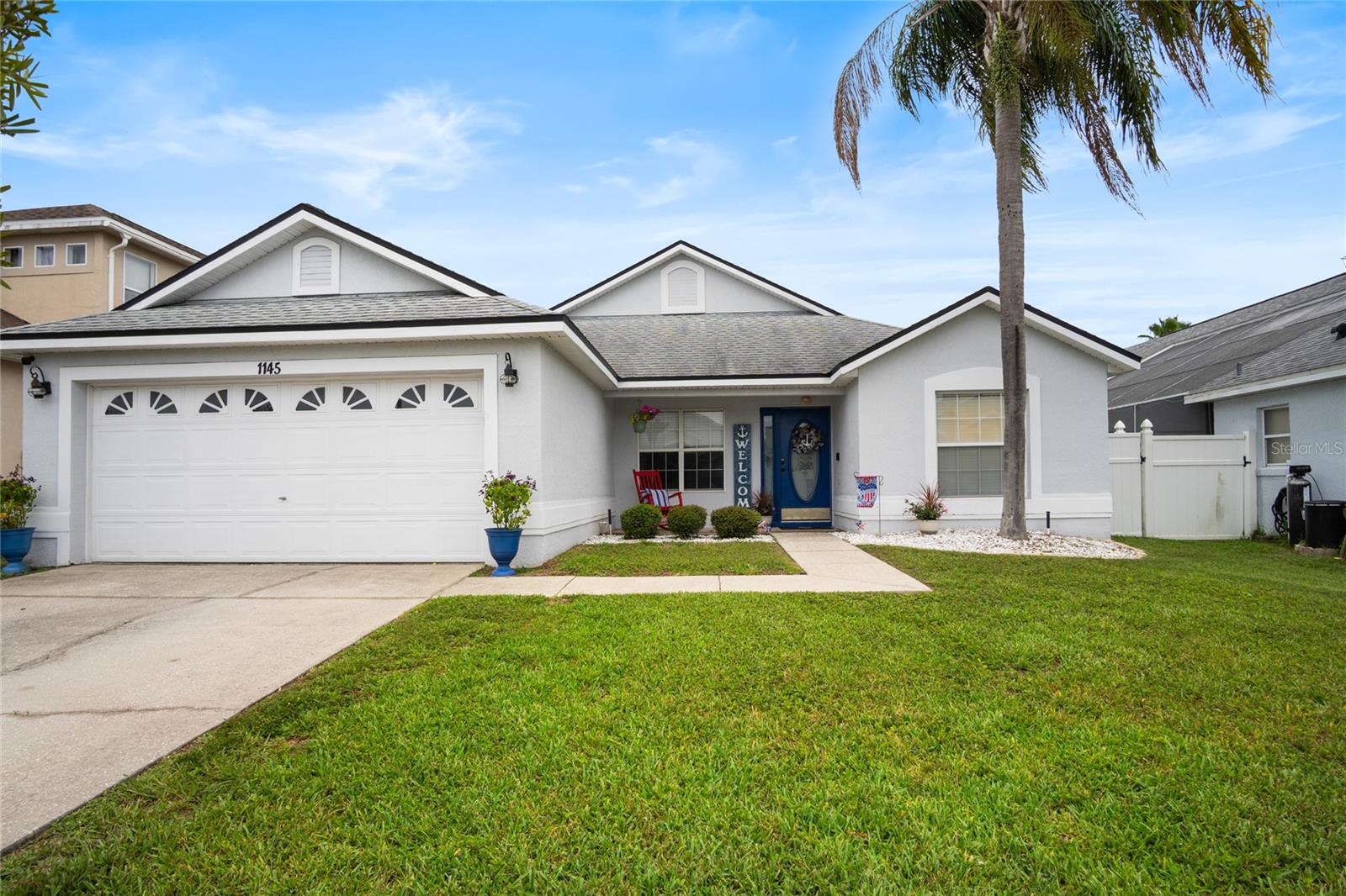 Welcome to this beautifully updated and meticulously maintained 4-bedroom, 2-bathroom pool home located in the desirable Fairways Lake Estates. With a thoughtful blend of style, functionality, and comfort, this home is move-in ready and ideal for use as a primary residence, vacation getaway, or short-term rental. Step inside and enjoy the many recent upgrades that elevate this home’s appeal, including a fully remodeled primary ensuite and guest bathroom (2024), new AC system (2023), and wood plank tile flooring installed throughout most of the home (2022). The kitchen was tastefully remodeled in 2021 and now features stainless steel appliances, granite countertops, a stylish backsplash, coffee bar, ample storage, and glass cabinets perfect for displaying your favorite dishware—all overlooking the covered lanai and screened-in pool. Additional updates include a new roof (2019), resurfaced pool (2018), vinyl fencing for privacy (2018), and a new water heater (2014). The air-conditioned garage offers a unique option for a home office or gym, perfect for remote workers or hobbyists. Inside, enjoy charming details like shiplap paneling, chair rail accents, built-in shelves in the guest bedroom, and custom touches throughout. The open living and dining area is ideal for entertaining family and friends, while the outdoor space provides a peaceful oasis to relax poolside or dine al fresco under the lanai. Fairways Lake Estates offers wonderful community amenities including a golf course, tennis and basketball courts, a playground, lake access for fishing, and a community pool—all with a low HOA fee. Conveniently located just minutes from Disney World, H2O Water Park, Margaritaville, shopping, dining, and medical facilities. Don't miss this opportunity to own a stylish and functional home in one of Central Florida’s most sought-after communities!