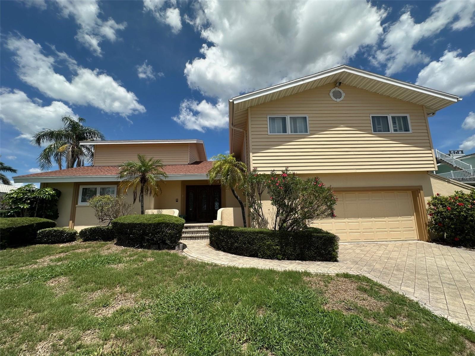 Exceptional Waterfront Opportunity on Island Estates – Renovate or Rebuild with Stunning & Rare Open Water Views!
Welcome to one of the most desirable waterfront locations in Clearwater Beach – Island Estates. This 5-bedroom, 4-bathroom home offers over 4,100 square feet of living space and sits on an expansive open-water lot just steps from the cul-de-sac, offering both breathtaking views and enhanced privacy.
This is a rare chance to either renovate a custom-built Mediterranean-style residence or build your dream home from the ground up on this prime piece of waterfront real estate. The property did experience flooding during the last major storm and is being sold as an opportunity for a full renovation or new construction.
Inside, enjoy water views from nearly every major room, including the spacious second-floor primary suite featuring a wood-burning fireplace and private balcony. The home’s layout includes a grand great room, and an open-concept family room that create a warm and inviting living space ideal for entertaining or everyday life.
Step outside to a large, tropical pool area and a lanai perfect for relaxing or hosting guests while taking in the sweeping views of the open Intracoastal waters. Boaters will appreciate the easy access to the Gulf of Mexico, just around the corner from your backyard.
Island Estates is a golf cart-friendly community and just minutes from Clearwater Beach, shops, restaurants, and the marina. Located approximately 15 miles from both Clearwater/St. Petersburg and Tampa International Airports, this property offers the best of waterfront living in a vibrant coastal setting.
Whether you’re dreaming of a luxury renovation or designing a brand-new waterfront estate, this Island Estates property presents a rare and exciting opportunity.