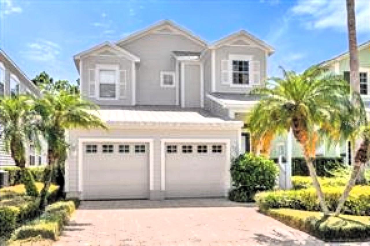 Beautiful 4/4 in Patriots Landing. As one of the few homes without a cumbersome pool to maintain, this home has a full length, screened-in, covered patio, that can be accessed via the beautiful French doors along the back wall, making this home feel it is one with nature. Downstairs features a large dining area fit to entertain, with a large family/living room to divide as you see fit. The downstairs bedroom has a separate bathroom. Upstairs you will find the master bedroom is a luxurious suite with a splendid bathroom, and the two additional bedrooms each have their own bathrooms. The home boast 2 new AC's and a new hot water heater also. Inside fresh paint was applied last May. Reunion has a lot of amenities, several pools are available to take a plunge, onsite restaurants, a playground, fitness center and walking paths.