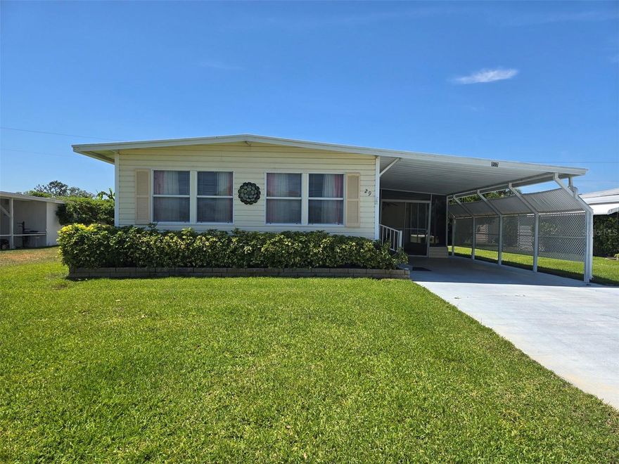 Priced to Sell! Well-maintained, move-in ready, and affordable! Located in the very popular Lake Tarpon Mobile Home Village 55+ Community. This charming 2BR/2BA manufactured home, built in 1970, sits on a spacious 0.14-acre lot and offers comfortable living with plenty of room to spread out, both inside and out. Step inside to find a light and bright interior with updated double-pane windows in key areas, enhancing energy efficiency and natural light. The home features laminate flooring throughout with tile in both bathrooms, and multiple ceiling fans with light fixtures for added comfort. The eat-in kitchen offers ample storage with two pantry closets, built-in microwave, built-In Oven, a cooktop, range hood, dual sinks, and a garbage disposal, making the kitchen functional and practical for everyday living. Both bedrooms are generously sized and each has a queen sized bed, his-and-hers closets, and built-in dressers, providing excellent storage. The primary suite features an ensuite bath, walk-in closet with shelving, and a private rear exit. Both bathrooms are equipped with step-in showers (no tub) and grab bars for added accessibility. Additional highlights include a Florida room entry, spacious living and dining areas with extra closet storage, and a fully furnished interior, making this home truly turnkey. Enjoy outdoor living with a large screened porch with easy access to the shed and back yard. Plenty of parking space with a carport and expanded three-car driveway. There are multiple storage options including a large shed with a stackable washer and dryer. Flooring is solid, Durable Metal Roof and Roof-over, and the irrigation system was just updated. This property has been very well cared for and offers a rare combination of space, functionality, and value—perfect for full-time living or a seasonal retreat. Very Low HOA Fee is $110 a month. Enjoy an active Florida lifestyle in this vibrant community offering a wide variety of clubs and social events. Golf cart friendly and Amenities include a newly remodeled heated pool, clubhouse with a full kitchen, sun deck, billiard room, card room, a library, private boat dock and fishing pier on beautiful Lake Tarpon, shuffleboard, bocce ball, horseshoes, Golf practice net, picnic and grilling area.  Conveniently located near shopping, restaurants, entertainment, golf courses, parks, beautiful beaches, and with easy access to two major airports. Come and see before it is gone!