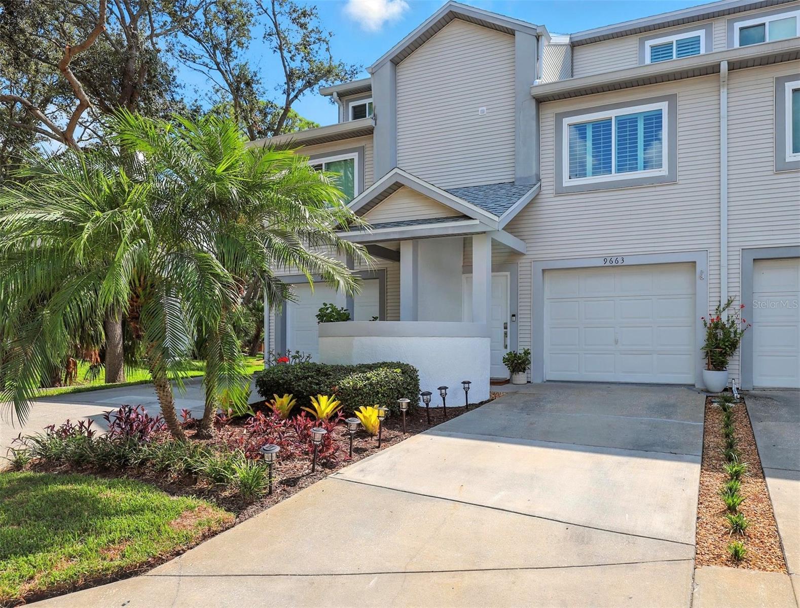Welcome to this stunning, fully remodeled 3-story townhouse located minutes from Indian Shores/Indian Rocks Beach in the desirable Tara Cay III community in Seminole, FL! Designed with modern elegance and comfort in mind, this home offers 3 bedrooms, 3.5 baths, and an open-concept floor-plan filled with natural light. The brand-new gourmet kitchen features white marble quartz countertops, space grey appliances, custom white shaker cabinetry with gold hardware, under-cabinet lighting and a spacious layout perfect for entertaining. The large master bedroom has dual custom closets with built-in shoe racks and a spa-inspired bathroom complete with custom tile that leads to a private deck to watch the sun rise/set. The first-floor bedroom with private entrance and custom-designed bath could also be a master bedroom! Luxury vinyl plank flooring flows throughout the entire home, complemented by recessed lighting, sleek two-panel doors and 5” baseboards. White oak stair treads with bullnose detail add a touch of craftsmanship, and brand-new hurricane-proof 12’ sliders on the second and third floors bring in abundant natural light. All ceilings have been raised to 8’, a unique luxury not found in most other townhomes in the community. Additional highlights include a dedicated office and custom-built laundry station with extra storage. The home is fully equipped with smart technology, including a Ring Doorbell, MyQ Garage, and Google Nest thermostat. Other updates include a newer roof (2019), A/C (2021), plantation shutters, new ductwork, updated plumbing, blown-in attic insulation and all-new fixtures and fans. With a one-car garage and countless modern upgrades, this townhome is move-in ready and just minutes from some of Florida’s most beautiful beaches and local attractions. The community offers a pool, boat ramp, and HOA-covered amenities including pool maintenance, lawn care, utilities, internet, and cable. Hurry and schedule your private showing today!