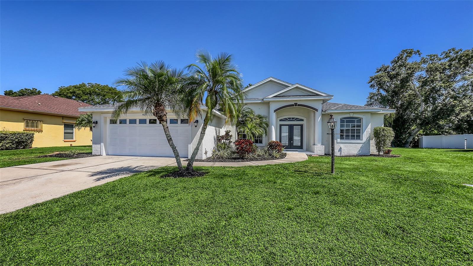 One of Sarasota’s most sought-after communities, with top A-rated schools and just minutes from Siesta Key Beach, this beautifully updated 3-bedroom, 2-bath home is ready to impress. 4079 Green Tree Avenue is located on a quiet street and highly desirable central location in Sarasota.
Step inside to find a light and bright interior, featuring newer floors, fully renovated bathrooms, fresh paint, and stylish new lighting, fans, and fixtures throughout. Multiple sliding glass doors and aquarium windows flood the living spaces with natural light, creating a warm and inviting atmosphere. The heart of the home is the spacious kitchen, thoughtfully designed with an open layout that seamlessly connects to both the main living room and the formal living area. This central hub makes entertaining effortless and everyday living a breeze, whether you’re hosting guests or enjoying a quiet family dinner. With its smart split floor plan, the home provides maximum functionality—offering a natural flow between spaces while ensuring privacy between the primary suite and guest bedrooms. The result is a home that feels both expansive and inviting, combining convenience with comfort.
The spacious primary suite offers new flooring, dual walk-in closets, and a luxurious bath complete with a garden tub, walk-in shower, and private water closet—designed for comfort and privacy. The living and dining rooms showcase wood laminate flooring and open seamlessly to a large covered patio, perfect for entertaining or enjoying quiet evenings outdoors.
With a NEW roof (Dec. 2024), NEW A/C system (Oct. 2024) thoughtful updates, freshly painted and a desirable split floor plan, this home combines peace of mind with modern style.
Green Tree residents enjoy low HOA fees of just $350 per year, proximity to the Legacy Trail less than ¼ mile away, and easy access to Sarasota’s best shopping, dining, and beaches. Zoned for Ashton Elementary, Sarasota Middle, and Riverview High, the location couldn’t be better.
Don’t miss the chance to own in this highly desirable neighborhood—schedule your showing today!