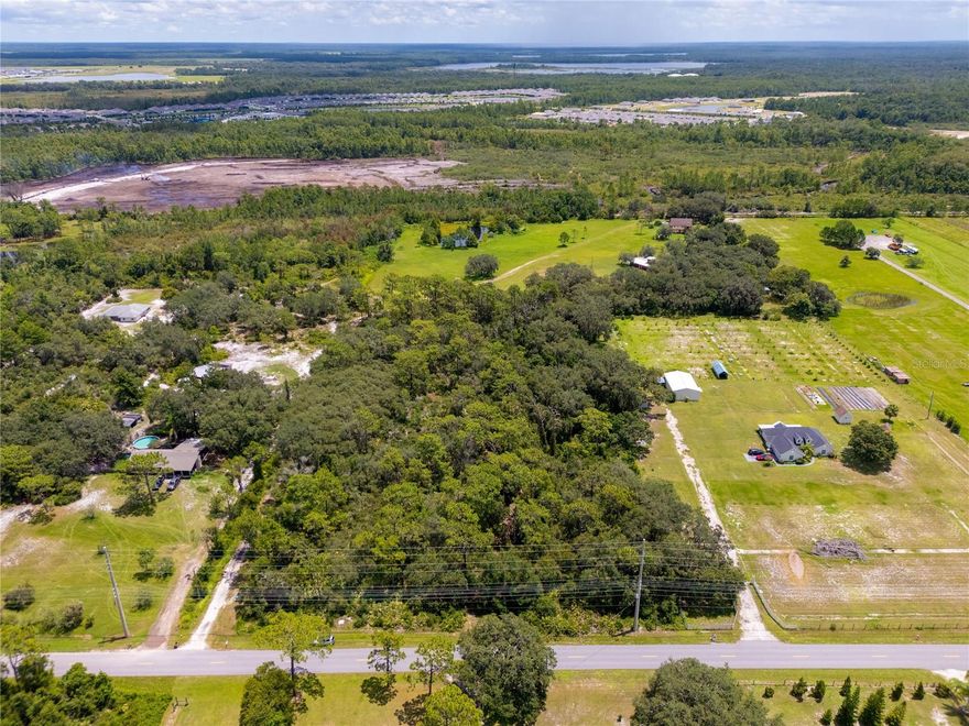 Buildable Parcel, Just Under 5 Acres by Lake Nona Medical City.   Surging demand in the Lake Nona / St. Cloud innovation corridor is making near-5-acre buildable tracts increasingly scarce. Secure a strategic position in Central Florida’s next chapter, where expanding infrastructure, high-quality jobs, top-tier healthcare, and lifestyle amenities meet rapid housing demand.  Just under 5 acres of buildable land located 10 minutes south of Lake Nona’s Medical City in St. Cloud, FL. Surrounded by major master-planned communities, Sunbridge, Weslyn Park, Preston Cove, and Roan Bridge, this parcel is ideal for developers, builders, investors, or a private luxury estate. Utilities are nearby, streamlining the path from concept to construction. Whether your vision is a small residential enclave, custom luxury homes, or a long-term land hold in a high-growth market, this site delivers location, scalability, and future upside.