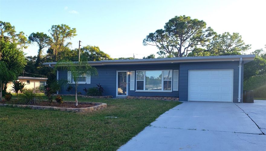 Beautifully renovated concrete block home situated on a generous corner lot. Whether you're looking for a starter home, forever home or vacation home, this one won't disappoint. Almost everything here is new again: Kitchen is a desired U-shape with luxury-look cabinets, new appliances and breakfast bar. Sparkling new bathroom with detailed tile work. New windows, floors and new paint inside and out. And the location can't be beat: walking distance to the elementary school, shops and restaurant. And, just a quick drive over the bridge to the beaches of Daytona Beach and Ponce Inlet. 220 Ft. screened back porch overlooks the backyard with large concrete patio and storage shed. Come see it, love it, and own it! ;Water: City