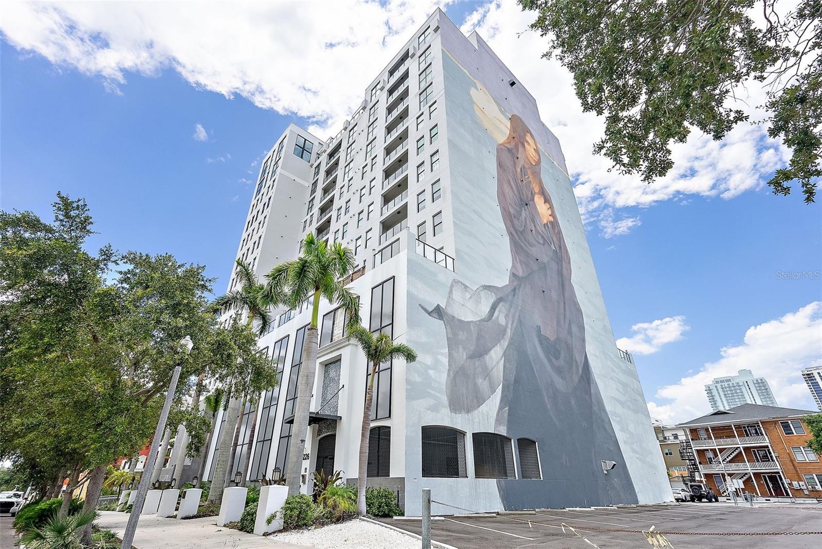 Welcome to urban living at its finest! This open floor plan, 2-bedroom, 2.5-bathroom condo, complete with a den, is nestled on the northern edge of downtown St. Pete and offers a pleasant blend of modern sophistication and classic charm. As you step inside, the split bedroom floor plan ensures privacy and convenience, with each bedroom boasting its own ensuite bath and walk-in closet. The easy-to-maintain polished concrete floors throughout add a touch of industrial chic, complementing the clean lines and contemporary aesthetics of The Walker Whitney building. The kitchen features high-grade granite countertops and a matching backsplash, alongside custom cabinetry and stainless steel appliances. Cooking and entertaining become a delight in this stylish and functional space. Step outside onto the balcony from the great room, where panoramic views of the picturesque OLD Northeast neighborhood and Tampa Bay await. This outdoor oasis provides ample space for creating your own tranquil retreat with outdoor furniture, perfect for enjoying the beautiful Bay breezes. The Walker Whitney itself is a testament to modern design and elegant simplicity. The building offers an ultra-clean, clutter-free environment with industrial-style interior finishes, providing a seamless connection between contemporary living and the timeless beauty of downtown St. Petersburg. Revel in million-dollar views from the rooftop that showcase the vibrant energy of the city and the stunning Tampa Bay. Convenience is key, with this downtown gem located just three blocks from Beach Drive, offering easy access to a myriad of restaurants, museums, theaters, and shopping. The Vinoy Resort and waterfront parks, spanning seven miles of shoreline, are just moments away, providing an abundance of outdoor activities. Embrace the ultimate affordable downtown lifestyle at The Walker Whitney - where classic urban living meets contemporary luxury. Live exactly where you want, in the heart of downtown St. Petersburg, and experience the best of what this vibrant city has to offer.