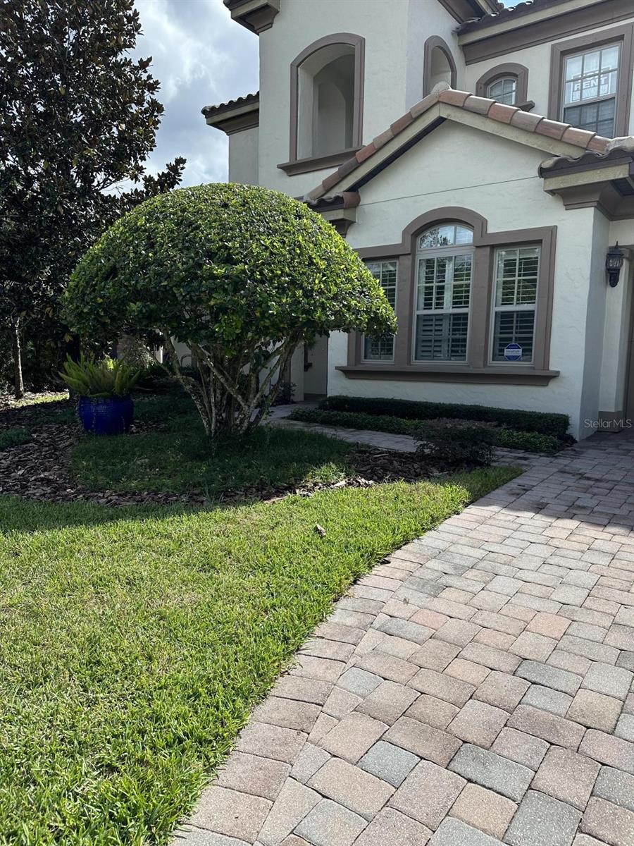 Welcome home to the prestigious community of Windsong in Winter Park. Upon entering this Toll Brothers-built home, you will notice no detail has been spared. Soaring ceilings greet you as you enter the foyer. This 4-bedroom 3.5-bathroom home is loaded with upgrades. The office includes beautiful wood and detailed custom bookshelves with a double door for privacy. The formal dining room features a pass-through to the Butler's Pantry, which in turn leads into a cook's oasis. Wolf stainless steel appliances for the serious chef, solid surface countertops. Gourmet kitchen opens up to the family room, so while you are in the kitchen, you can still be a part of the party. Great floor plan for entertaining friends and family. Eat in nook is located off of the kitchen for dinners together. The primary suite is located on the first floor with a spa-like ensuite. Double vanity, extra-large shower, and large bathtub for the nights when a relaxing bath is just what you need after a long day. Upstairs, you will find a bonus room, as well as the remaining bedrooms and bathrooms. Off of the bonus room is a bedroom and bathroom, great for guests. The other bedrooms and bathroom are located on the other side of the upstairs to create a split floor plan. Large backyard for enjoying the Florida weather. This home features numerous upgrades, too many to list. Community offers a playground and resort-style pool with lake views. Call today to view. Close to restaurants, schools, and shopping.