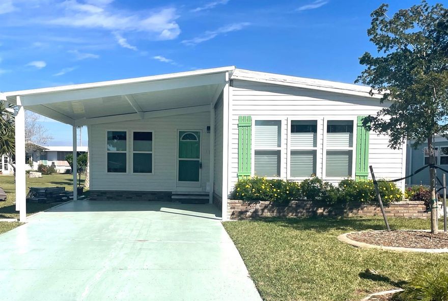 Nestled in the serene Lazy River community of North Port, Florida, this charming manufactured home offers the perfect blend of comfort and waterfront living. Situated along a canal off of the Myakka River, the property boasts a private dock, providing residents with easy access to the water and stunning views right from the rear lanai. The home features a split plan with 2 bedrooms and 2 bathrooms, providing a cozy and inviting living space. Enjoy the convenience of a new roof and addition of an extra wide carport, enhancing the property's functionality and aesthetic appeal. This turnkey furnished home features many thoughtful upgrades that include a new refrigerator, dishwasher, disposal, and modern toilets. The master bedroom is tastefully furnished with new furniture and a Sleep Number bed, ensuring a restful night's sleep. Whether you're a water enthusiast, nature lover, or simply seeking a peaceful retreat, this Lazy River home with its captivating water view and thoughtful amenities promises an idyllic lifestyle in the heart of North Port, Florida.