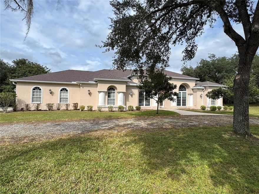 RARE OPPORTUNITY! This Pine Ridge Estates 5.5 acre pool home offers serenity and luxury and borders one of the 28 miles of equestrian trails. Featuring spacious living areas and versatility for those seeking a quiet retreat. A separate 1000+ sf block building with a full bath, laundry and 14x20 bedroom space provides flexible options - ideal as a guest suite or barn/apartment. The home is move in ready but may need personal decorative touches. It presents an opportunity to customize a beautiful estate to your exact vision.