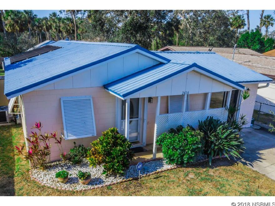 With worry-free updates, this home is a great starter or retirement home where Flood Insurance IS NOT REQUIRED! Easy STORM SHUTTERS, METAL ROOFING and WIND-RATED WINDOWS ensure major discounts on homeowners insurance and provide peace of mind. New AC & HEAT installed in 2017. In addition to the living square footage, the enclosed Florida Room features insulated roofing and could easily be used as an office and/or workout area. The 2nd Bedroom is installed with a Murphy Bed - great for guests! The screen-enclosed, IN-GROUND POOL with automatic cleaner promises low maintenance and year-round usage. The OPEN KITCHEN has GRANITE COUNTER TOPS, cozy breakfast bar, tiled backsplash, pull-out shelving, STAINLESS APPLIANCES and 42-inch cabinetry.The PRIVACY-FENCED backyard features an INSULATED 10 X 10 SHED, which serves nicely as a CRAFT ROOM OR WORKSHOP with laminate flooring, electrical outlets, windows and lighting. You will not find carpeting in this home with tile and laminate flooring throughout! This home is "GAS READY" and plumbed for a whole-house gas generator.  BOATERS: NSB public boat ramps are less than a mile from this home! The beach is only 6 miles. This home is ready for new owners that wish to make the most of their Florida lifestyle! Ask about a FREE Home Warranty. All measurements are approximate. ;Water: City