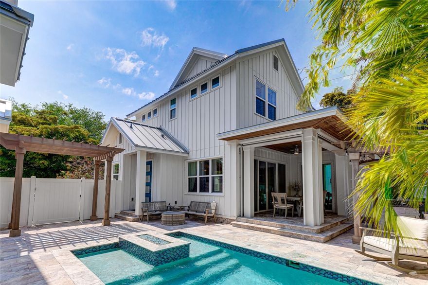 Welcome to 505 South Osprey Avenue, a stunning property located in the picturesque and historic neighborhood of Laurel Park, right in the heart of Downtown Sarasota. This exceptional residence offers a unique lifestyle, reminiscent of a private compound within the city's core. Featuring a main house, guest house, two-car garage, and an enchanting outdoor entertainment space, this property promises a truly unparalleled living experience.

As you enter the main house, you will be captivated by the open floor plan that highlights a chef's kitchen equipped with top-of-the-line appliances, including a Thermador wine cooler and Bosch coffee machine. The kitchen flows seamlessly into the great room, which is adorned with wood plank ceilings and a 42-inch linear gas fireplace, creating a warm and inviting atmosphere. Adjacent to the kitchen and great room is a separate dining room with a coffered ceiling and floor-to-ceiling windows, providing a beautiful setting for entertaining guests with an abundance of natural light.

One of the home's most distinguished features is the rare inclusion of a FIRST-FLOOR primary bedroom and bathroom, offering convenience and sophistication. This primary suite boasts soaring ceilings, a spacious walk-in closet, and luxurious spa-like bath amenities, offering a tranquil retreat for relaxation.

Upstairs, a private bonus/media room provides ample space for leisure activities, while two additional bedrooms with en-suite baths ensure comfort and privacy for family or guests. Adding to the charm of this residence is the fourth bedroom, located above the garage in the in-law suite. This suite offers a Uline beverage center, private bath, and a delightful balcony, exuding comfort and hospitality.

The indoor/outdoor living experience of this home is exceptional. The great room features sliders that open to the covered lanai, where electronic floor-to-ceiling screens allow for a seamless integration of indoor and outdoor spaces. The natural-toned travertine deck leads to a refreshing pool and a heated spa, perfect for daytime relaxation or evening enjoyment. The outdoor summer kitchen, fully equipped for culinary adventures, invites cooking and dining under the sun or stars.

Discover why 505 South Osprey Avenue is one of the most unique and desirable homes in one of Florida's finest locations, Downtown Sarasota. This property is not just a home, but a lifestyle waiting to be experienced.