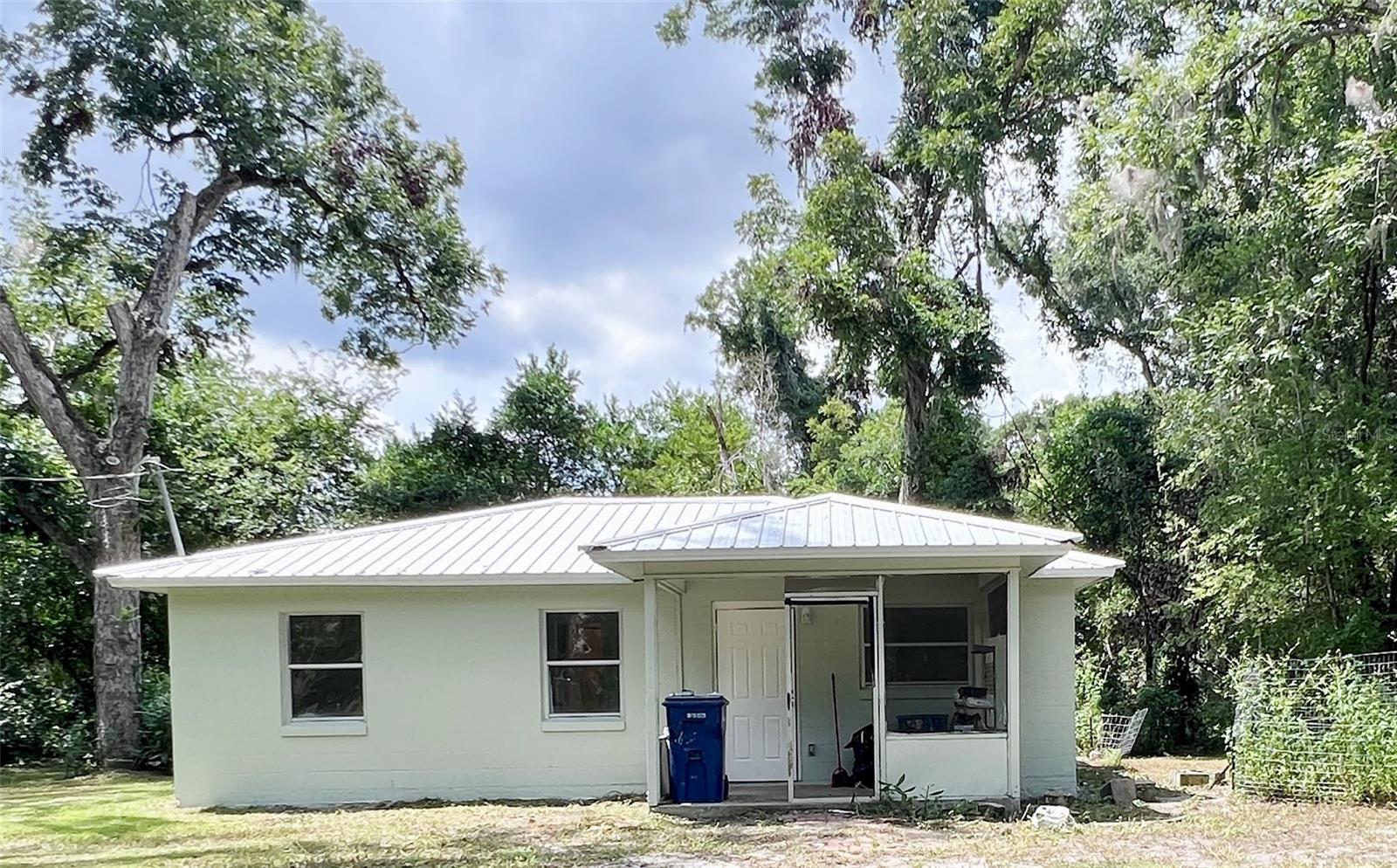 One or more photo(s) has been virtually staged. Welcome to this well-built concrete block 3-bedroom home, set on more than 1 acre in Archer, FL. Featuring a durable metal roof less than 6 years old, a brand-new 2024 HVAC system, a 2025 water heater, all-new stainless steel appliances, and a complete refresh throughout, this property is truly move-in ready. The open-concept layout is perfect for both everyday living and entertaining, with luxury vinyl plank flooring flowing seamlessly throughout the home. Bathroom has been thoughtfully updated with new fixtures, toilets, and modern finishes, while fresh interior and exterior paint give the entire home a crisp, welcoming feel. Situated on over an acre lot, you’ll have plenty of outdoor space to relax, garden, or entertain while enjoying the peaceful surroundings. Conveniently located near schools, shopping, and dining, with easy access to Gainesville, this home perfectly combines the charm of small-town living with modern comfort. If you’re searching for an updated home near Gainesville that’s completely move-in ready, this property is the one. Don’t miss out—schedule your showing today!