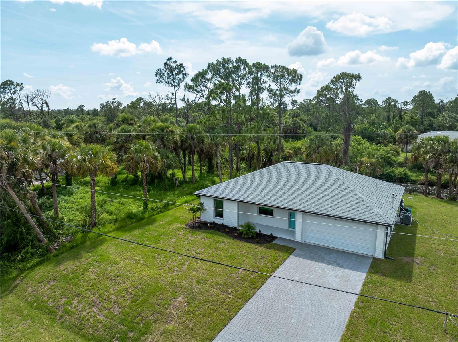 Exclusive Opportunity: Secure Your New Residence with MarDon and Benefit from UP TO $5,000 in Flex Cash. MarDon is pleased to present this exceptional 4-bedroom, 2-bathroom residence situated in Port Charlotte, Florida. All our homes are constructed with a commitment to quality and include a 2-10 Builder's Warranty and impact-resistant windows as standard features. This particular property offers a well-designed 1710 sq ft layout, featuring a desirable split floor plan, elegant wood-look tile flooring throughout, and refined quartz countertops in the kitchen. The master suite provides a private en-suite bathroom for enhanced comfort. Located within a convenient North Port community, residents will appreciate proximity to essential amenities, dining establishments, recreational opportunities, and major transportation routes. MarDon is dedicated to providing a superior product with numerous upgrades at a competitive price point, facilitating long-term equity growth for homeowners. Interested parties are encouraged to schedule a private viewing at their earliest convenience.
Important Note: Please be advised that certain photographs may depict a professionally staged model home with the same floor plan and may not accurately reflect the specific fixtures present in all available properties.