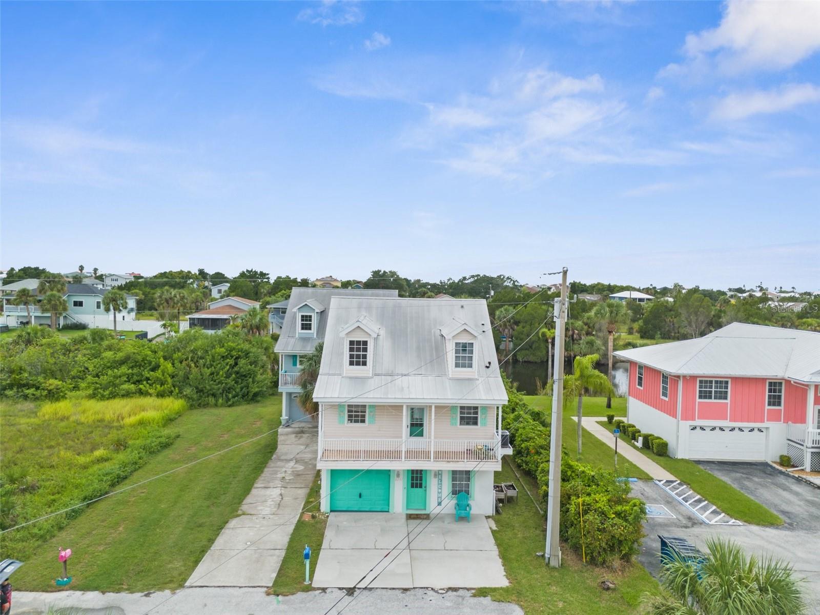 Price improvement!! Adorable waterfront Key West style Home with indirect Gulf Access via boat-lift. 3 story home, but don't worry about carrying up those groceries. Park the car in the garage and just take the interior elevator servicing all floors. This Is a cute 3 bedroom 2 1/2 bath home. Relax and soak in the beautiful water views and stunning sunsets on the screened balconies/porches. Live where you vacation. Embrace the coastal vibe walking or biking to all the great restaurants & the corner store. This home is perfect for fishing & all your water toys. Marina is also just a skip away. Home boasts bedrooms on all separate floors for privacy. Hernando Beach seems secluded, yet it's minutes from all amenities on U.S.19.Public boat ramps, Weeki Wachee water park, beach and Sun West are just a minutes away. Easy commutes to Tampa or Orlando whether for work or play. See it today and imagine the magic of living here Please verify all information for accuracy.