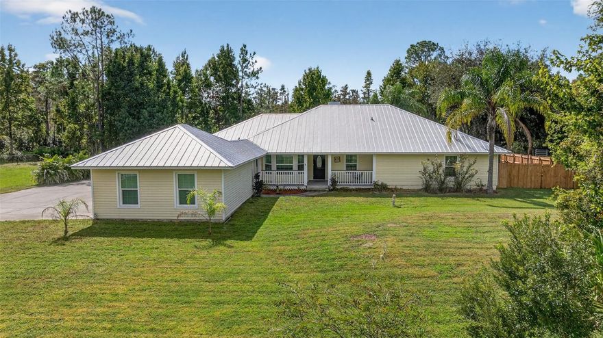 Welcome To Your Private Florida Estate At 26530 Green Willow Run In Wesley Chapel! Nestled On Just Over 2.04 Acres In The Highly Desirable Quail Hollow Pines Community, This Custom Built Home Offers 2,448 Square Feet Of Refined Living Space With 3 Bedrooms, 2.5 Bathrooms, A Den/Flex Space, Formal Living & Dining Rooms, And An Oversized 2-Car Garage. 

From The Moment You Arrive, You’ll Appreciate The Long Driveway, Mature Landscaping, and Tropical and Local Trees And Serene Setting That Combine The Peace Of Country Living With Easy Access To Shopping, Dining, Major Highways And Top-Rated Schools.

Step Inside To Find An Open Concept Living Space, Including A Formal Living And Dining Room Perfect For Entertaining, And A Spacious Family Room That Opens Directly To A Screened Pool Deck. The Kitchen Features New Quartz Countertops, A Breakfast Bar on the Center Island, Stainless-Steel Appliances,  Backsplash And A Sunny Daily Dining Nook Overlooking The Pool – Ideal For Everyday Living And Casual Gatherings.

A Dedicated Den/Flex Space With French Doors Opens To The Pool Deck – Perfect For A Home Office, Playroom Or Guest Retreat With Immediate Access To Outdoor Living.

The Expansive Primary Suite Is A True Retreat With Crown Molding, A Dual Faced Fire Place in the Primary Suite and Primary Bath, A Large Walk-In Closet And A Spa-Style En-suite Bathroom Featuring Dual Vanities, Granite Counters, A Soaking Tub, And An Oversized Walk-In Shower With Multiple Shower Jets. This Truly Split Floorplan Features Two Additional Bedrooms And A Hall Bathroom.

Outside, The Expansive Screened Lanai And Sparkling Gunite Pool With Waterfall Provide The Ultimate Florida Outdoor Oasis — Ideal For Relaxing, Entertaining Or Simply Enjoying The Peaceful Setting. The Fully Fenced Yard Offers Generous Space For Pets, Gardening Or Future Expansion. 
Notable Features Include: Brand New Air Conditioning, Roof Replacement with Metal Roof (2017) And Pool Re-Marcited (2019), New Well Bladder (2021), Kinetco Water Filtration System — All With No HOA, No CDD, And No Deed Restrictions. This Is A Rare Opportunity To Own A Custom Pool Home With Acreage In One Of Wesley Chapel’s Most Sought-After Neighborhoods. Experience The Perfect Blend Of Luxury, Privacy And Convenience — Schedule Your Private Tour Today!