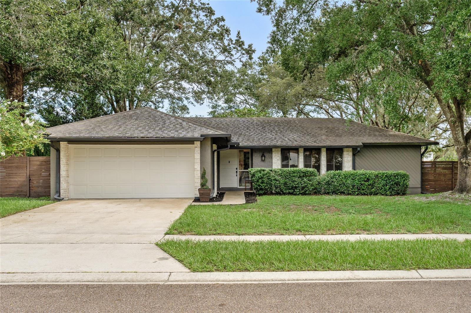 Featuring over $80k in owner-updates spanning 2021-2023, this 3-bedroom, 2-bath home combines comfort, style, and functionality that will have you thinking it’s a much larger home. Step inside to find welcoming, open concept living space, sleek laminate flooring and a modern, contemporary design starting with a bright white kitchen, island and farmhouse sink at center, nestled between the dining and living rooms. You’ll find custom touches like perfectly placed built-ins where you need them and good use of space- owners created a private office space without sacrificing a bedroom. Bedrooms are split with primary suite on one side, complete with roomy walk-in closet an extraordinary bathroom that is a true standout, featuring a glass-enclosed soaking tub and rain shower space that creates a spa-like retreat. 2nd and 3rd bedrooms are on opposite sides of home and share a full bathroom that also works for guests.
The spacious fenced backyard provides plenty of room for outdoor activities, while the expansive 500 sq ft enclosed Florida room (not included in living space) is ideal for year-round entertaining or simply relaxing in comfort.
Nestled within Tuscawilla Ridge, Saddlehorn Circle is a quiet street of just a handful of homes with no thru traffic, offering a peaceful setting. The home is also zoned for highly rated Seminole County schools, including Rainbow Elementary just a short walk away.
With its thoughtful updates, inviting spaces, and sought-after location, this home is ready to be your next move. House fully re-piped, AC 2022, water heater 2025 and ROOF replacement or credit will be considered. Kitchen appliances, fixtures, Nest doorlock, doorbell/camera and thermostat all 2021 or newer.