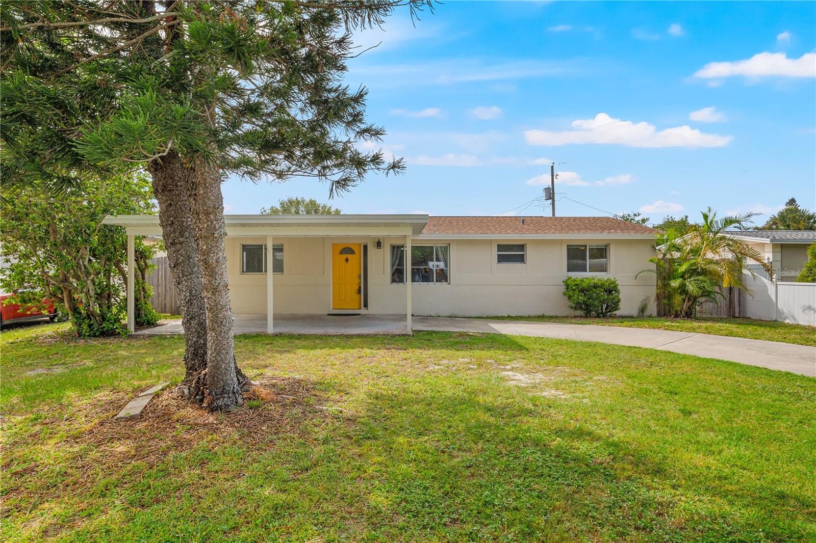 Spacious 4BR/2BA Home with Updated Kitchen, Fireplace, and Outdoor Pergola – Short Drive to Madeira Beach and no Flood Zone insurance required! Welcome home to this beautifully updated 4-bedroom, 2-bathroom property in St. Petersburg’s desirable unincorporated area, perfect for homeowners or investors seeking Airbnb rental opportunities. Located in a prime spot just approximately 6.5 miles (about 15–20 minutes) to Madeira Beach, where you’ll enjoy pristine white sands, vibrant shops, and waterfront dining at the famous John’s Pass Village & Boardwalk. Step inside to discover a bright and open layout featuring a modern kitchen with stylish cabinetry and updated finishes, seamlessly connected to the expansive family and dining area highlighted by a cozy fireplace. Ceramic tile and laminate flooring throughout the entire home, offering durability and easy maintenance. A new outdoor pergola extending your living space, creating a charming patio dining area ideal for entertaining guests. Don’t miss this versatile property offering comfortable living and excellent short-term rental potential!