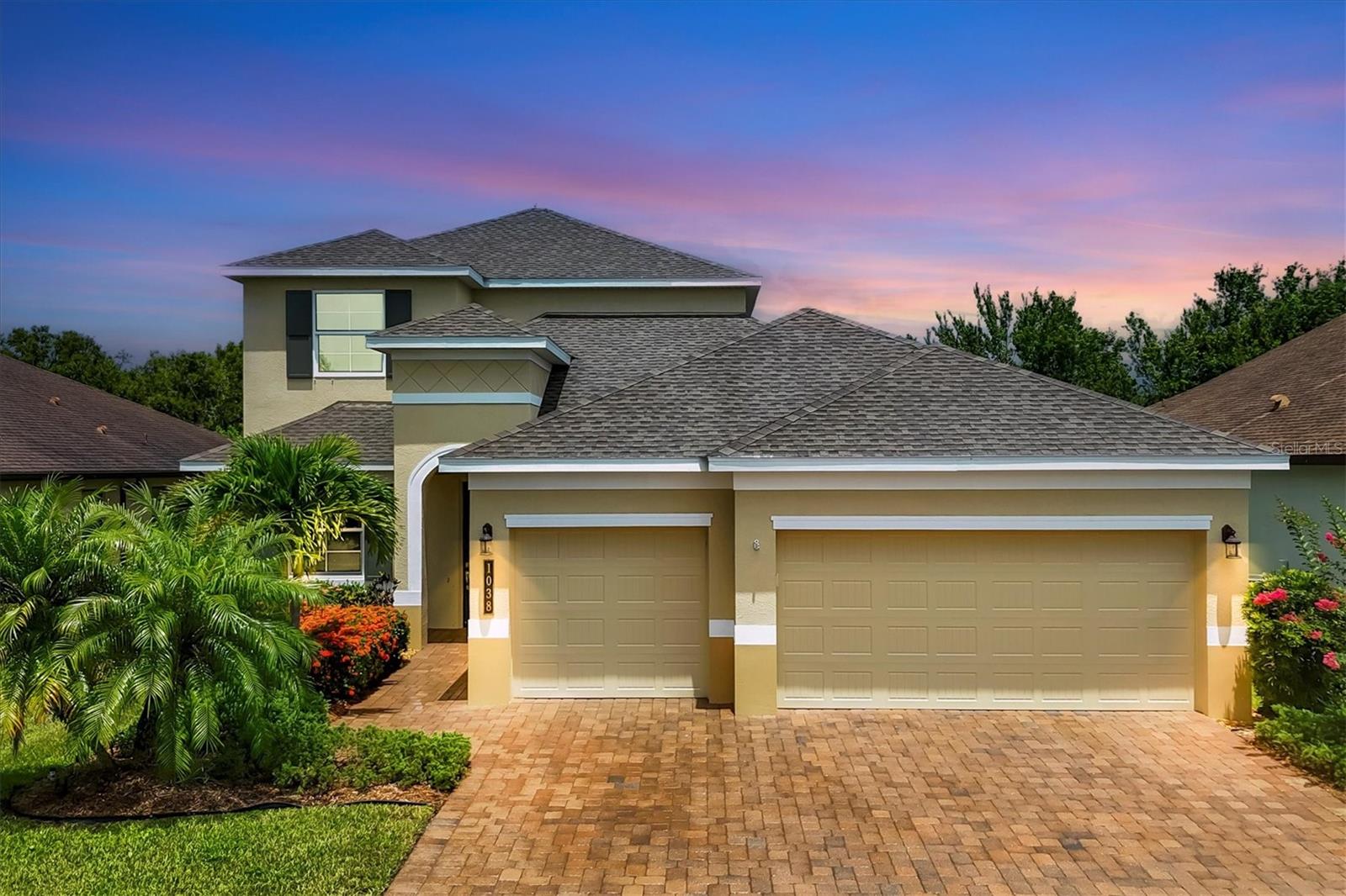 Stylish coastal design defines this Sam Rodgers-built residence nestled in the gated enclave of Greyhawk Landing West. Located on a quiet double cul-de-sac and bordered by lush preserve and lake views, this 3-bedroom, 2.5-bathroom home offers over 2,900 sq ft of thoughtfully designed living space and more than 3,900 total sq ft. Built in 2016, this two-story home delivers bright, open interiors and exceptional flow—ideal for everyday comfort and effortless entertaining. High ceilings and abundant natural light welcome you into the heart of the home, where an open-concept layout connects the spacious family room and kitchen. A full triple pocket slider leads to the extended lanai, creating a seamless connection to the outdoors. The kitchen is both stylish and functional, featuring Energy Star-rated stainless steel appliances, a natural gas range, quartz countertops, a large island, and a generous eat-in area. A separate large dining room offers a more formal option for hosting guests or special occasions. The first-floor primary suite is a peaceful retreat with an oversized walk-in closet featuring built-in shelving and a spa-style bath complete with quartz-topped dual vanities and a large walk-in shower. A flexible office on the main level can also serve as a fourth bedroom, and a convenient powder room completes the first floor. Upstairs, a spacious bonus room, two additional bedrooms, and a full bath provide versatile space for guests, media, or hobbies. The lanai is open to preserve and water views, offers a tranquil setting for outdoor dining, relaxing, or entertaining, with plenty of space to add a custom pool. Additional features include a walk-in storage closet originally designed as an elevator shaft, wide doorways, lowered switch plates for accessibility, designer ceiling fans, custom blinds, and mature landscaping. Greyhawk Landing is a gated, amenity-rich community offering two resort-style pools, tennis and pickleball courts, a fitness center, sports fields, playgrounds, miles of scenic walking trails, and year-round community events - all for just $113/year. Located in Lakewood Ranch, one of the nation’s premier master-planned communities, you’ll enjoy easy access to I-75, top-rated schools, Waterside Place, UTC, downtown Sarasota, and the award-winning Gulf Coast beaches.