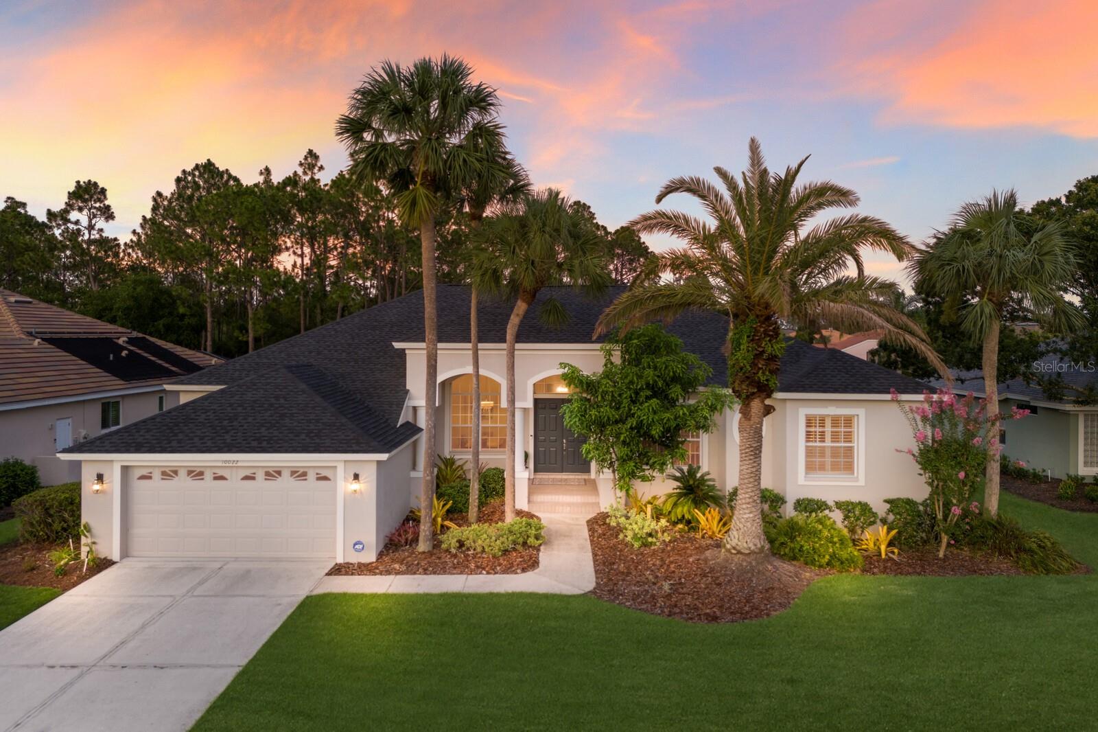 Tucked away on a quiet cul-de-sac in River Club—one of Lakewood Ranch’s most sought-after neighborhoods—this 3-bedroom, 3-bathroom pool home offers 2,679 sq ft of bright, open living space on a private 0.29-acre lot with lush tropical landscaping. Enjoy the best of Florida living with low HOA fees, no CDD fee, and a prime central location. From the moment you step through the double-door entry, you’ll be welcomed by soaring ceilings, an abundance of natural light, and an open-concept layout designed for indoor-outdoor living. Multiple sliding glass doors throughout the home open to the screened lanai with a pool and spa, creating the perfect setting for entertaining or relaxing in total privacy. A den off of the front of the house is the perfect space for an office or home gym. The spacious kitchen features white cabinetry, granite countertops, stainless steel appliances, and a large breakfast bar—flowing into the great room with a fireplace and custom shelving. A separate formal dining room and sunny breakfast nook provide plenty of space for both casual and elegant dining. The primary suite is a true retreat with tray ceilings, views of the pool, a walk-in closet, and a spa-like bath with dual sinks, soaking tub, and walk-in shower. Two guest bedrooms are located on the opposite side of the home for added privacy. Step outside to your own tropical escape, surrounded by mature landscaping. Relax by the pool and spa, dine al fresco under the stars, or simply unwind with the soothing sounds of nature. Enjoy peace of mind with recent upgrades including a new roof (2021), fresh exterior paint (2024), new pool pump (2025), and updated appliances: range (2024), dishwasher (2023), and dryer (2022). New lighting fixtures throughout add a modern touch. Complete with a separate laundry room and an oversized 2-car garage with a golf cart bay, this home combines comfort, style, and location! River Club is centrally located to all that Lakewood Ranch has to offer with a low HOA fee and it is one of the few communities in Lakewood Ranch without a CDD fee. Don’t miss the opportunity to make this River Club residence your own!
