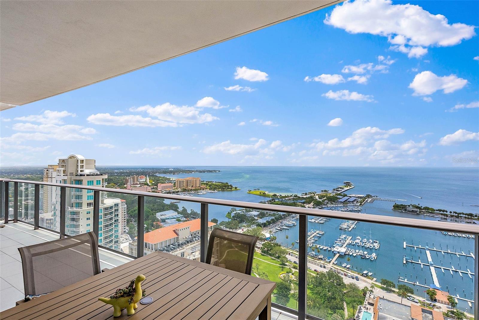 EXQUISITE FULLY FURNISHED WATERVIEW CONDO IN THE HEART OF DOWNTOWN! Welcome to the epitome of luxury living. This magnificent 2-bedroom plus den and 2.5-bathroom condo offers a brilliant water view from the 32nd floor and interiors that are filled with high-end features and upscale finishes throughout. Rich plank tile flooring throughout creates a seamless flow of living space, enhancing the open floor plan that allows natural light to cascade through the home. The gourmet kitchen is a chef's dream, boasting a center island, custom backsplash, upscale stainless-steel appliances, and designer lighting. Prepare culinary masterpieces while enjoying the stunning water views that stretch clear across the Bay. Indulge in outdoor living at its finest on your private balcony, overlooking the sparkling waters, the new St. Pete Pier, boats going in and out of the marina and planes taking off and landing at the local airport. Imagine sipping your morning coffee while watching the sunrise over Tampa Bay or enjoying a glass of wine as you soak in the breathtaking views of the DTSP waterfront and its sparkling city lights. Retreat to the spacious owner’s suite, where you'll find more amazing views, a custom walk-in closet and a luxurious dual vanity master bath with glass walk-in shower. The second bedroom also offers an en suite bath, and an additional den provides a versatile space that can be used as a home office, media room, or even an additional guest room with a hall bath just to the outside of the entrance. Convenience and comfort are paramount in this condo, with a stackable washer/dryer discreetly tucked away in the laundry closet in the entryway foyer. As a resident of ONE St. Petersburg, you'll have access to unparalleled resort-style amenities. Host memorable gatherings in the formal social room, complete with fireplaces and a gorgeous bar area. Unwind in the game room, featuring a billiards table, or embrace the indoor/outdoor club room for a more relaxed ambiance. The expansive 40,000-square-foot amenities deck offers a 75' lap pool, cabanas, a rejuvenating spa, lush landscaping, an outdoor kitchen, fire pits, and abundant plush seating. Stay active and focused in the 5,000-square-foot yoga and fitness center, designed to cater to your wellness needs. Beyond your luxurious private oasis, this condo's location is a true urban paradise. With a remarkable 92 walkability rating in downtown St. Pete, you'll be steps away from endless culinary options, shopping destinations, museums, theaters, galleries, sports arenas, movie theaters and more... Immerse yourself in the vibrant culture and energy of the city, knowing that your home is a sanctuary of tranquility waiting for your return.