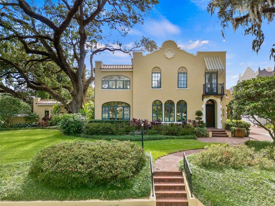 Stunning completely remodeled, historic Mediterranean home and guest house in the heart of Downtown Orlando’s desirable Lake Cherokee neighborhood! This unique luxury residence, built in 1925 and meticulously updated, spans 4,722 SF and is surrounded by majestic live oaks, offering a perfect blend of timeless craftsmanship and modern elegance. The foyer opens to the formal living room with a fireplace. The living room flows into a separate formal dining room with a fireplace both with original hardwood floors and high ceiling. The sunroom and large open space kitchen, casual dining, and family room have handcrafted tile flooring with hardwood inlay. The kitchen/family room has cypress beams, custom arched window, and Palladian-style French doors that flood the space with natural light and open to a brick terrace. The terrace is beautifully landscaped with an Old Florida array of plants and trees. The gourmet chef's kitchen is a culinary dream, featuring new quartz countertops, Zellige backsplash tiles, distressed walnut-stained cabinets, and high-end stainless steel appliances, including a Subzero wine refrigerator, Dacor gas cooktop and oven Bosch dishwasher and Sharp under-counter microwave. There is also a walk-in pantry. The custom-made stove hood with crown molding is the elegant focal point of the kitchen. The powder room has British wallpaper reminiscent of the famous palms décor in the Beverly Hills Hotel and The Colony in Palm Beach with a custom vanity, granite, and sink. This home has a floor plan that is perfect for entertaining on a large or intimate scale. The main house includes three bedrooms and two and a half bathrooms. There is a fully detached charming guest house- full bathroom, and kitchenette. Enjoy modern conveniences with an elevator, electrical systems 2023, and multiple water heaters. New Carrier AC (handler and condenser) first floor 2025. New commercial-grade AC capacitor 2025. Ducts replaced 2020. Roof installed in 2020, office/ bonus room roof replaced 2025. Guest house roof coating 2025. Three new water heaters and Pex pipes installed in the basement 2023. Exterior of the home re-painted 2024. Epoxy garage floors, and custom-built cabinets in the primary suite. There is a separate laundry room on the second floor. The second-story bedrooms and the large office have lovely views overlooking Cherokee Park. Most interiors have been freshly repainted, and custom shutters enhance the primary suite's appeal. The primary bath has dual vanities with new counters and fixtures. Three garages and ample parking. A screened breezeway from the garage to the kitchen/family room provides protection from the elements. A lovingly maintained home. Perfectly situated between Lake Cherokee and Lake Davis, and just across from Cherokee Park, this home is ideally located for morning walks or evening strolls around the lakes. Experience unparalleled living in one of Orlando’s most sought-after neighborhoods, where every detail has been carefully selected and quality crafted for the ultimate luxury lifestyle! Walk to Dr. Phillips Performing Arts Center, Thornton Park restaurants and shopping, and close to all major roads.