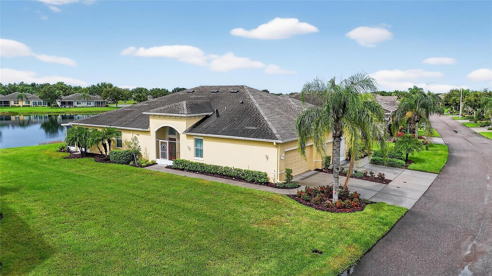 (No HOA FEE'S UNITIL APRIL 2025)
Now is your time to start enjoying the real Florida lifestyle, with maintenance-free benefits and breathtaking water
views that make it even better. Nestled in the highly desired King’s Point’s Nottingham Villas, this 2-bedroom 2-bath
"Mahogany" villa with a large den and separate dining area with tasteful upgrades, crown molding, high ceilings, newer
light fixtures, epoxy flooring in the garage and Extended screened in lanai & so much more! This marvelous home is built for the
balanced lifestyle with just the right amount of privacy, yet a stunning open floor plan. The home boasts neutral tones
with solid surface flooring throughout the main living areas and granite countertops. A chef's dream spacious kitchen
with New Stainless-steel appliances tons of cabinetry, convenient rollouts, and a massive island bar. The spacious owner's
suite includes a large en-suite master bath with beautiful palm tree wallpaper, which provides beautiful thoughts of
paradise, dual sinks, and a walk-in closet providing plenty of storage. The second bedroom along with a spacious guest
bathroom that includes a shower/tub combo located on the opposite side of the home. A bonus den that offers a great
flexible space to design your home and makes for the ideal floor plan to entertain & appreciate comfortable, easy, fun
and simple living. Onto one of the most amazing areas of this home is the expansive screened-in lanai with epoxy
flooring and a speechless view. Kings Point is an active 55+ community with an abundance of amenities including six
pools, over 200 clubs, nature trails, 2 beautiful clubhouses, 2 saunas, whirlpools, and activities to keep you occupied.
This is a golf cart community that has other nearby public golf courses that you can take your cart to. Some of the
most beautiful Gulf Beaches are located within a 30-minute drive. Call to schedule your showing so you can enjoy this
beautiful home in Kings Point.