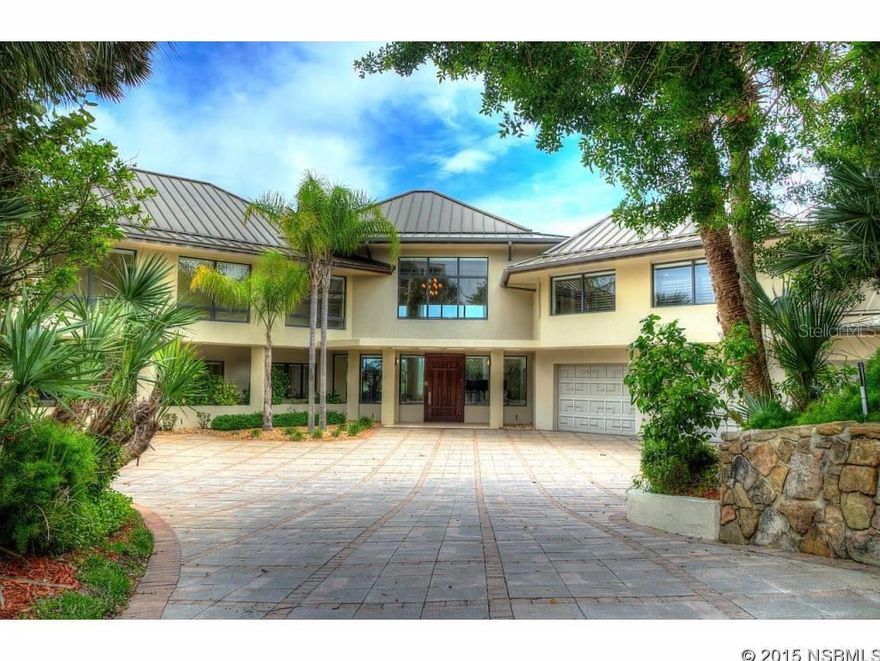 Fabulous, extremely private 1 acre North Beach oceanfront estate. This one-of-a-kind property was renovated & architecturally redesigned in 2000. Originally built with reinforced concrete block with precast concrete slabs between the floors. Decks, walkways & entry area that were added are post-tensioned concrete. The renovations include a fabulous kitchen with SieMatic cabinetry, Gaggenau cooktop, Subzero Integrated Refrigerator & Freezer, Meile dishwasher, Thermador double convection/micro/thermal ovens, granite counters & backsplash. Extensive use of travertine & Brazilian Cherry flooring. Impact glass windows & doors. Gallery entry to private master suite with beautiful travertine, marble & granite bath & large custom closet. Two of the guest bdrms are oversized & have adjoining spacious baths. Oversized garages with showroom gallery 3rd bay separate garage. Wet bars on both levels. New roof 2011. Note: some portions of the building are pre-2000, dating back to 1984. This property is shown by advanced appointment to qualified buyers only please. ;Water: City