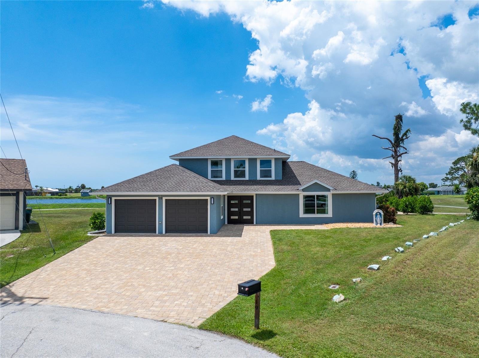 Welcome to your dream home! This beautifully remodeled 3-bedroom plus office/bonus room, 2.5-bathroom pool home is perfectly situated on a quiet cul-de-sac, offering privacy, peace, and views of lush ponds, wildlife and the golf course beyond. And don't miss the expanded paver driveway allowing parking for up to 6 vehicles.
Step inside to a completely updated interior featuring an open, light-filled floor plan designed for modern living. High-end finishes, fresh paint, and stylish flooring flow throughout, creating a warm and inviting atmosphere. The chef’s kitchen boasts new cabinetry, quartz countertops, and stainless-steel appliances, seamlessly connecting to the dining and living areas—ideal for entertaining or relaxed family living. A convenient half-bath is perfect for guests.
The spacious, first floor primary suite includes a walk-in closet and a luxurious, en-suite bathroom, while upstairs you will find two additional bedrooms that share a beautifully updated full bath. This home has also been thoughtfully designed to have dual zone AC units for managing the temperature on the first and second floors.
Step outside to your private backyard oasis, complete with a sparkling pool (built August 2020), screened lanai (replaced 2023) and fire pit—perfect for enjoying Florida’s sunny days and spectacular sunsets over the water and fairways.
This home has had many major updates including roof (November 2022) impact doors, windows and garage doors ( November 2022), dual water heaters (November 2022) and dual zoned HVAC (August 2020).
Please note this home is in 2 Flood zones, the driveway and a piece of the garage is in flood zone 8AE but the main home is in the X zone. So please consult your lender and/or insurance agent for more information on flood insurance requirement.
Move-in ready, this home offers the best in comfort, style, and scenery. Don’t miss this rare opportunity—schedule your private showing today!