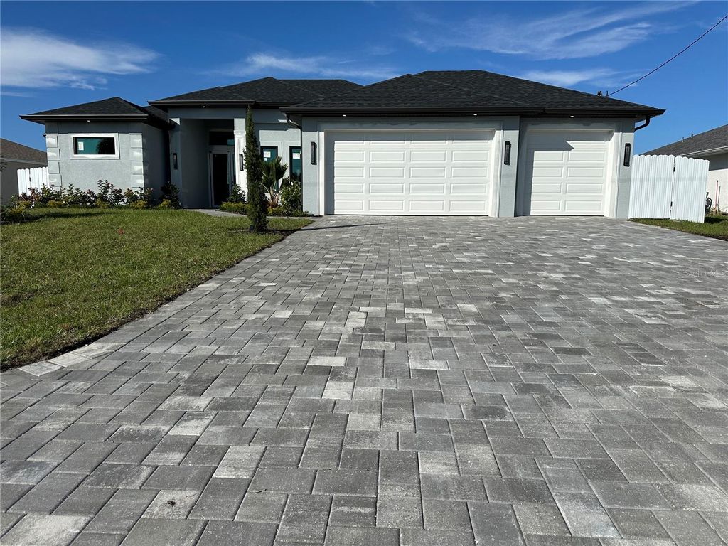 Photo of 933 NW 8th Terrace, Cape Coral, FL 33993 (MLS # A4636025)