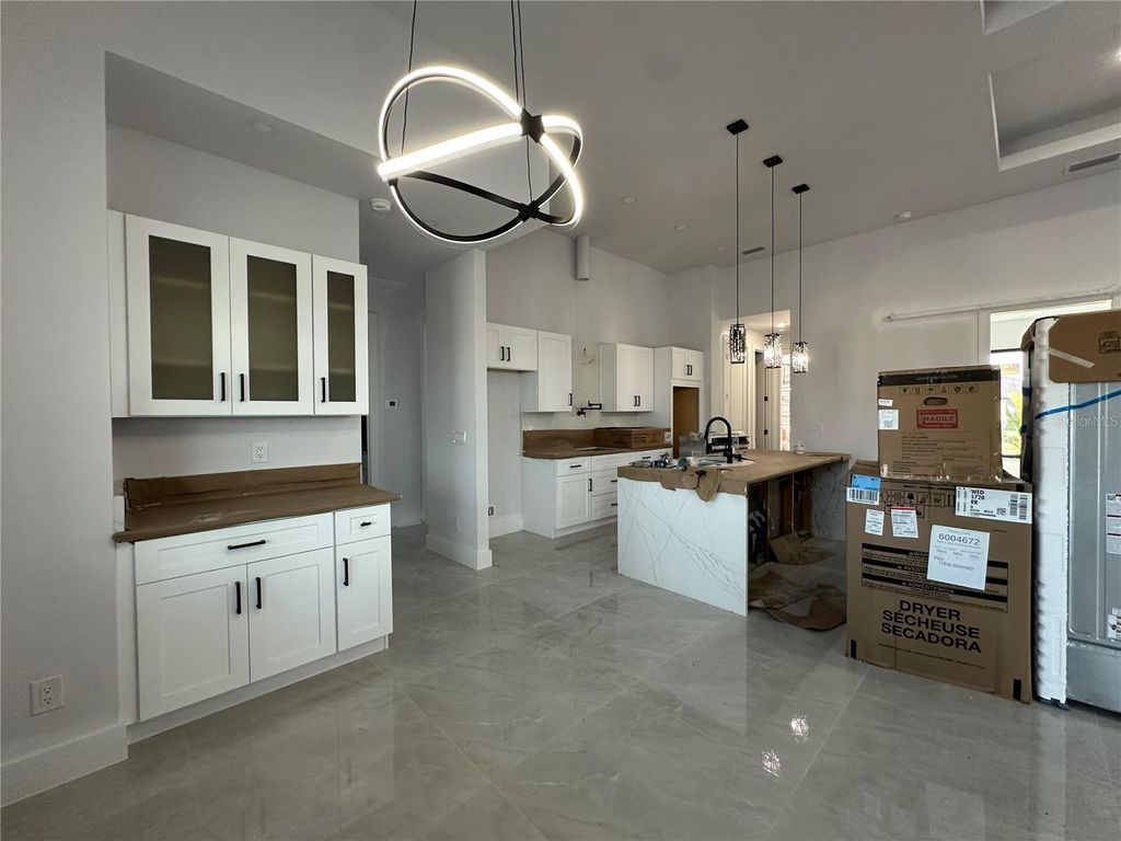 Photo of 933 NW 8th Terrace, Cape Coral, FL 33993 (MLS # A4636025)