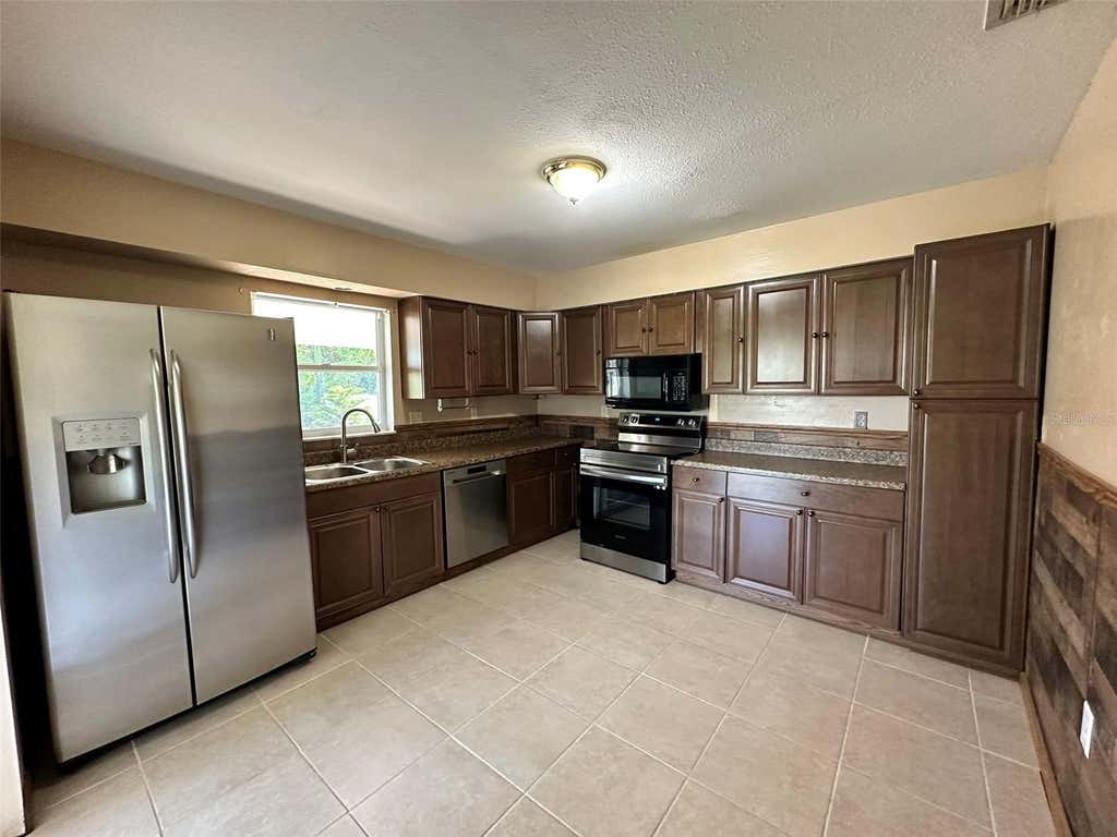 Photo of 1067 Webster Avenue NW, Port Charlotte, FL 33948 (MLS # C7529381)