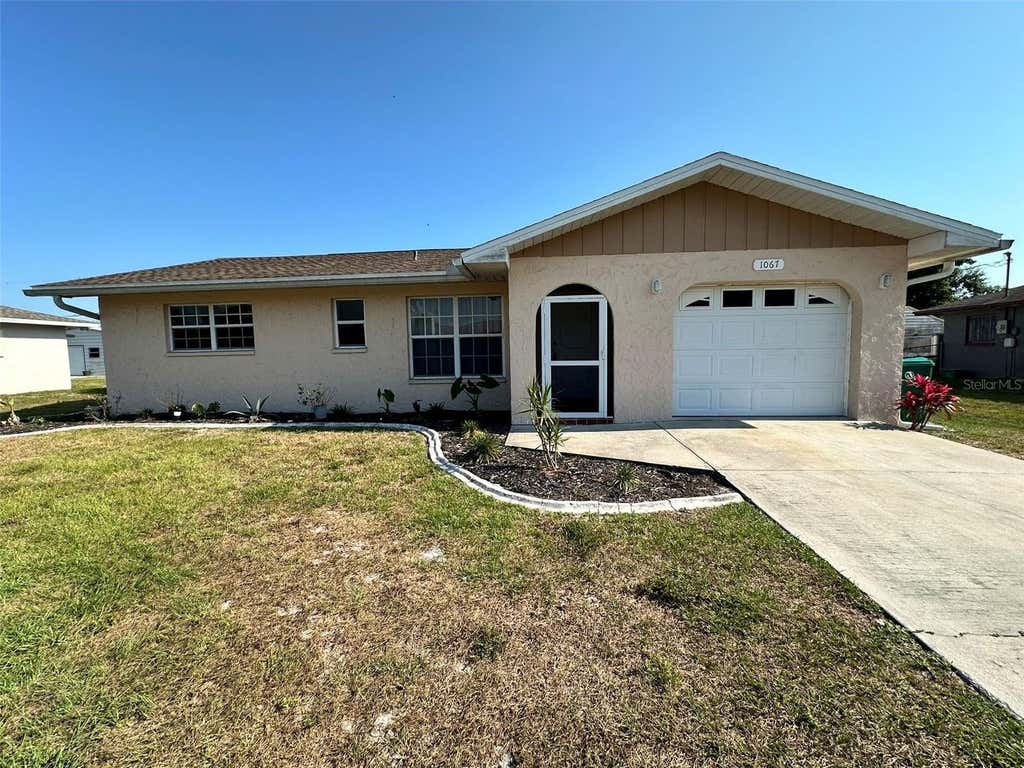 Photo of 1067 Webster Avenue NW, Port Charlotte, FL 33948 (MLS # C7529381)