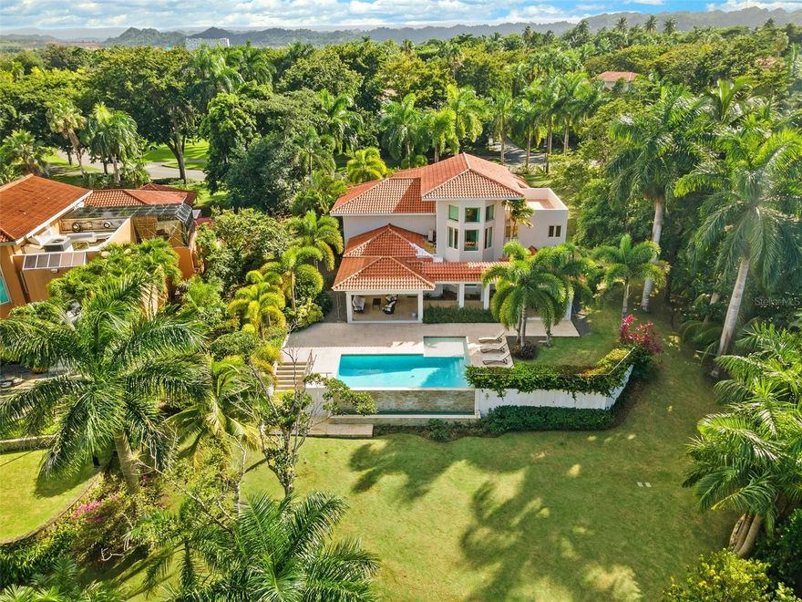 This sun-drenched and spacious property has 5 bedrooms, 6.5 bathrooms over 6,000 sq. ft. and sits within a lush and tropical community. The open and contemporary property boasts cathedral ceilings, tiled floors throughout, a dream kitchen with all high-end appliances and a secluded, fully-furnished outdoor patio/backyard. Large Infinity Pool overlooking the East Golf Course

The Dorado Beach East community is private, gated, family friendly and offers a wide range of facilities that you can enjoy. The facilities include scenic pools, clay tennis courts, basketball and beach volleyball courts, a basic gym, a game room, a 3-par golf course that winds through the neighborhood, and an aviation themed park which has a custom water park and sand park.

Located within the Dorado Beach Resort, since it is a 2,000-acre natural reserve most of the communities are 1-3 miles away from the beach and Hotel. This being said, the entire resort is interconnected via golf cart trails, meaning that you can have easy access (walking or in golf cart) to the different communities and amenities within this Resort.