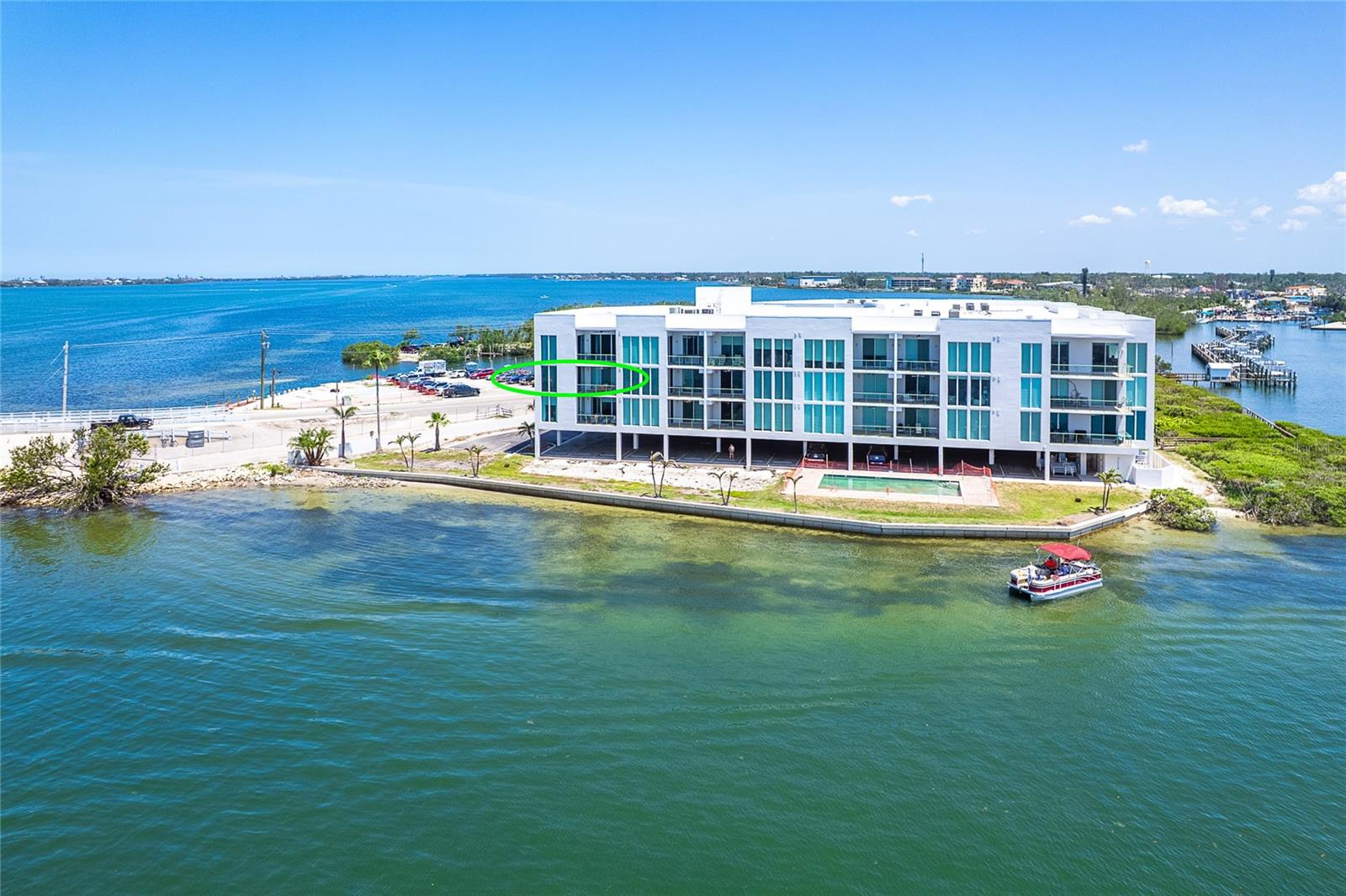 Turnkey Waterfront Luxury with Private Boat Lift & Panoramic Bay Views at Redfish Key Villas
Welcome to effortless coastal elegance in this fully furnished, move-in-ready 2-bedroom, 2.5-bath residence at the highly sought-after Redfish Key Villas. Perfectly positioned at the water’s edge, this exceptional condominium offers breathtaking panoramic views of Lemon Bay, refined interior finishes, and a deeded boat dock with private lift—an extraordinary opportunity for boating enthusiasts and luxury lifestyle seekers alike.
Designed with a modern, open-concept layout, this spacious first-floor unit features 10-foot ceilings and expansive hurricane-impact glass sliders and windows, showcasing unobstructed water views from nearly every room. The chef’s kitchen is both stylish and functional, with custom wood cabinetry, granite countertops, and premium stainless steel appliances, seamlessly flowing into the main living space.
The Primary Suite is a true waterfront retreat, offering direct lanai access, tranquil bay views, and a spa-inspired bath with a soaking tub, walk-in shower, and dual vanities. The generously sized second bedroom also enjoys water views and ample storage, making it ideal for guests.
Step outside to your oversized 11' x 15' private lanai, the perfect setting to enjoy morning coffee or evening sunsets while watching dolphins, manatees, and seabirds drift through the bay.
Included in this rare offering is Boat Slip, equipped with a private lift, allowing immediate access to the Intracoastal Waterway and the open Gulf. Redfish Key Villas also provides a suite of resort-style amenities, including a heated bayside pool, fishing pier, secure gated entry, and covered under-building parking.
Located just one mile from the pristine beaches of Manasota Key, and minutes from Palm Island, Boca Grande, and the vibrant communities of Englewood and Venice, this coastal gem places you near world-class fishing, golfing, waterfront dining, and boutique shopping.
Bring your boat, your bathing suit, and your sense of adventure—this is turnkey waterfront living at its finest.