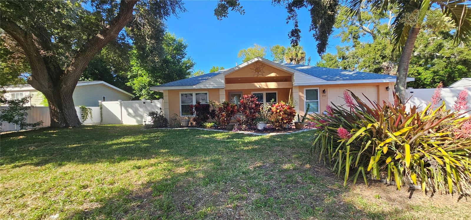 Beautifully updated 3-Bedroom, 2-bath, 1-car garge block home 1,457 sq. ft. on an oversized 88x88 lot in a NON-FLOOD ZONE neighborhood!!! NO FLOOD INSURANCE REQUIRED. This home features RV/Boat parking on garage side thru double gates, fresh white paint throughout, new luxury vinyl plank flooring and ceiling fans in every room with lots of outlets and lighting. The open-concept kitchen includes an island with breakfast bar, stainless steel appliances, newer double-pane windows with a vinyl sliding door that fills the home with natural light. Vinyl fenced yard with large storage shed, nice concrete patio for a grill, table and chairs to enjoy all the great weather we have in Florida! Major updates include a new roof (2023) AC (2019) The bathrooms are fully functional and are ready for your own personal touch or modern updates. Metal corregated hurrican shutters, front load LG washer/dryer included and located in the garage. Home has had only 1 owner since built 20 years ago in 2005. Foundation had signs of 1 inch settlement on back corner and was professionally repaired in October with Solid Foundations licensed contractor with transferrable lifetime warranty. This home is solid and has been very well maintained. You'll love being just 3 miles from downtown St. Pete, less than a mile to coffee shop, restuarant and bar, 15 min. to Gulf Beaches and 30 min to Tampa Int'l Airport. New development is happening all around this area- dont miss this great opportunity to own in such a great area!