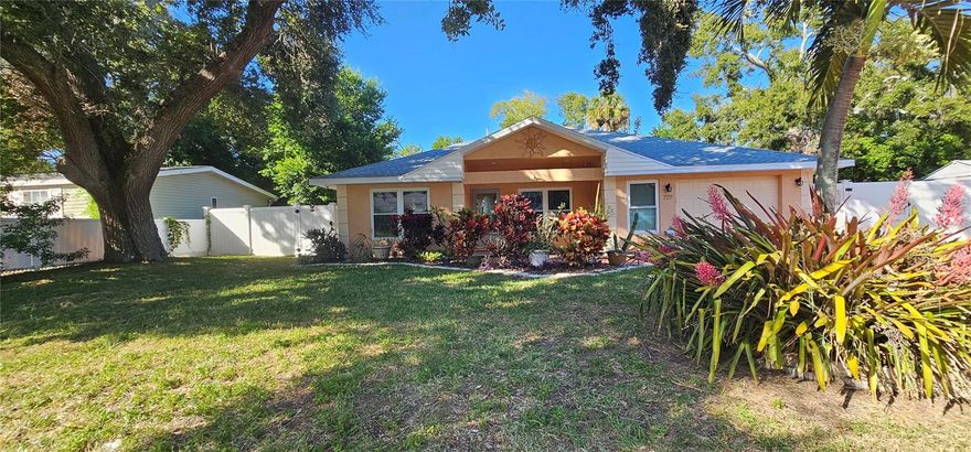 Beautifully updated 3-Bedroom, 2-bath, 1-car garge block home 1,457 sq. ft. on an oversized 88x88 lot in a NON-FLOOD ZONE neighborhood!!! NO FLOOD INSURANCE REQUIRED. This home features RV/Boat parking on garage side thru double gates, fresh white paint throughout, new luxury vinyl plank flooring and ceiling fans in every room with lots of outlets and lighting. The open-concept kitchen includes an island with breakfast bar, stainless steel appliances, newer double-pane windows with a vinyl sliding door that fills the home with natural light. Vinyl fenced yard with large storage shed, nice concrete patio for a grill, table and chairs to enjoy all the great weather we have in Florida! Major updates include a new roof (2023) AC (2019) The bathrooms are fully functional and are ready for your own personal touch or modern updates. Metal corregated hurrican shutters, front load LG washer/dryer included and located in the garage. Home has had only 1 owner since built 20 years ago in 2005. Foundation had signs of 1 inch settlement on back corner and was professionally repaired in October with Solid Foundations licensed contractor with transferrable lifetime warranty. This home is solid and has been very well maintained. You'll love being just 3 miles from downtown St. Pete, less than a mile to coffee shop, restuarant and bar, 15 min. to Gulf Beaches and 30 min to Tampa Int'l Airport. New development is happening all around this area- dont miss this great opportunity to own in such a great area!