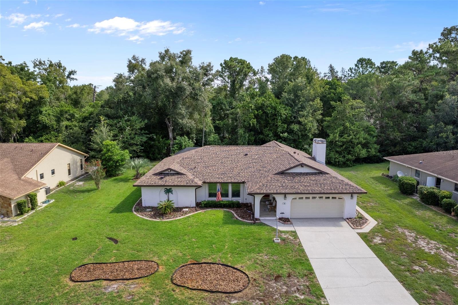 Welcome to this beautifully maintained 3-bedroom, 2-bathroom pool home offering 2,348 sq. ft. of comfortable living space on a .28-acre lot in sought-after Sugarmill Woods. Step inside and enjoy a bright, open floor plan with new dual-pane windows (2018), mostly tile flooring, and abundant natural light throughout. The kitchen is a chef’s delight, featuring a breakfast bar, pantry, tons of cabinet space, and a pass-through to the Florida room—great for entertaining. Gather with friends and family in the expansive Florida room overlooking the heated saltwater pool and greenbelt backdrop. This home has a New roof (2024) for peace of mind , AC (2010), New hot water heater (approx. 3 years old), Gas fireplace for cozy evenings, Inside laundry room with tub for convenience and versize 2 car garage. This home is designed for both relaxation and entertaining, blending indoor comfort with Florida’s outdoor lifestyle. Whether you’re hosting gatherings, enjoying a quiet swim, or simply unwinding in front of the fireplace, this Sugarmill Woods gem has it all. Don’t miss the chance to call this spacious pool home your own!