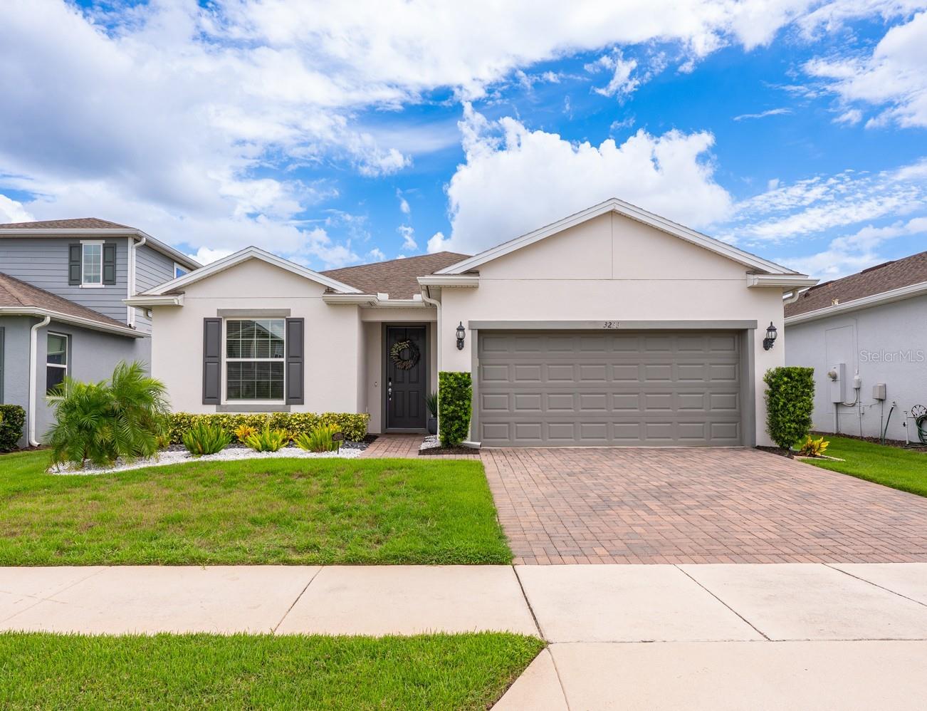 Ask about a lender provided RATE BUY-DOWN CREDIT on this home /// Seller may consider buyer concessions if made in an offer
/// Welcome to Lakeview Preserve, one of Winter Garden’s most sought after gated communities, where Johns Lake serves as a pristine backdrop and lifestyle amenities make every day feel like a retreat! BUILT IN 2020 and still feeling brand new, this 3-bedroom, 2-bath home means you don’t have to wait for new construction – just move right in and start enjoying. From the moment you step inside the light and bright OPEN CONCEPT floor plan makes an impression. Rich ENGINEERED HARDWOOD FLOORS flow through your main living areas, while recessed lighting and stylish fixtures add just the right amount of sparkle. Off the foyer glass inset French doors open to a dedicated office – perfect for working from home, complete with a chic accent wall. Across the foyer you will also find a thoughtfully designed CUSTOM MUDROOM and LAUNDRY ROOM that access the garage, keeping things organized. The chef inspired kitchen is the true heart of this home, delivering sleek countertops, must have STAINLESS STEEL APPLIANCES, subway tile backsplash, pantry storage, and a generous ISLAND with bar seating – it’s designed for both cooking and gathering! A window over the sink lets in plenty of natural light, and the open layout keeps you connected to the living and dining areas. The layout of this home is both smart and welcoming – bedrooms two and three share a hallway and full guest bath at the front of the home, offering privacy for family or visiting guests. At the back, your PRIMARY SUITE is a spacious getaway with a large WALK-IN CLOSET and well appointed en-suite bath. Double pane windows throughout keep the home efficient and quiet, while the OWNED WATER SOFTENER (2022) adds comfort and convenience. Love spending time outdoors? Sliding glass doors open up to an expansive SCREENED PAVER LANAI, perfect for relaxing or entertaining friends, overlooking a nice sized backyard. Low maintenance living means more time to enjoy everything around you! Beyond your front door, Lakeview Preserve delivers RESORT STYLE AMENITIES: a sparkling POOL, fitness center, playground, picnic area, and more – all secured within the GATED COMMUNITY. Plus, with easy access to the 429 you are close to Downtown Winter Garden, Horizon West, Orange County National Golf Center & Lodge, and all of Central Florida’s best dining, shopping, and entertainment. Theme parks and adventure are also just a short drive away! If you have been dreaming of a NEW HOME FEEL in a prime Winter Garden location, this one checks all the boxes. Immaculate condition, thoughtful upgrades, and a community you will love coming home to – don’t wait, schedule your tour today and let us say WELCOME HOME!