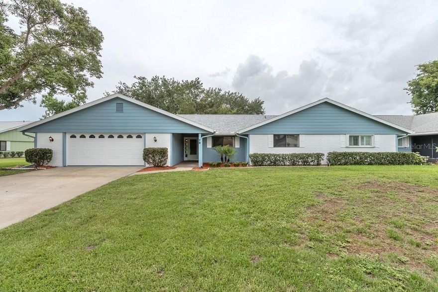A beautiful Hidden Lakes golf course, waterfront home located at 76 Lake Fairgreen Cir, New Smyrna Beach, FL 32168. A well-designed & quiet duplex home, 1,861 sq ft, built-in 1984. 3 bedroom, 2 bathrooms with a large two-car garage and separate laundry room with ample space for storage or workshop. The roof is new - 2021, fresh exterior and interior paint, appliances, fixtures. Wood floors throughout with a custom office space. Lots of natural light, overlooking the water-facing windows in the large spacious living, dining family room area. If you are looking for privacy, golf access, and quality, this property is for you. There is an HOA pool access available. Restrictions apply. ;Water: City