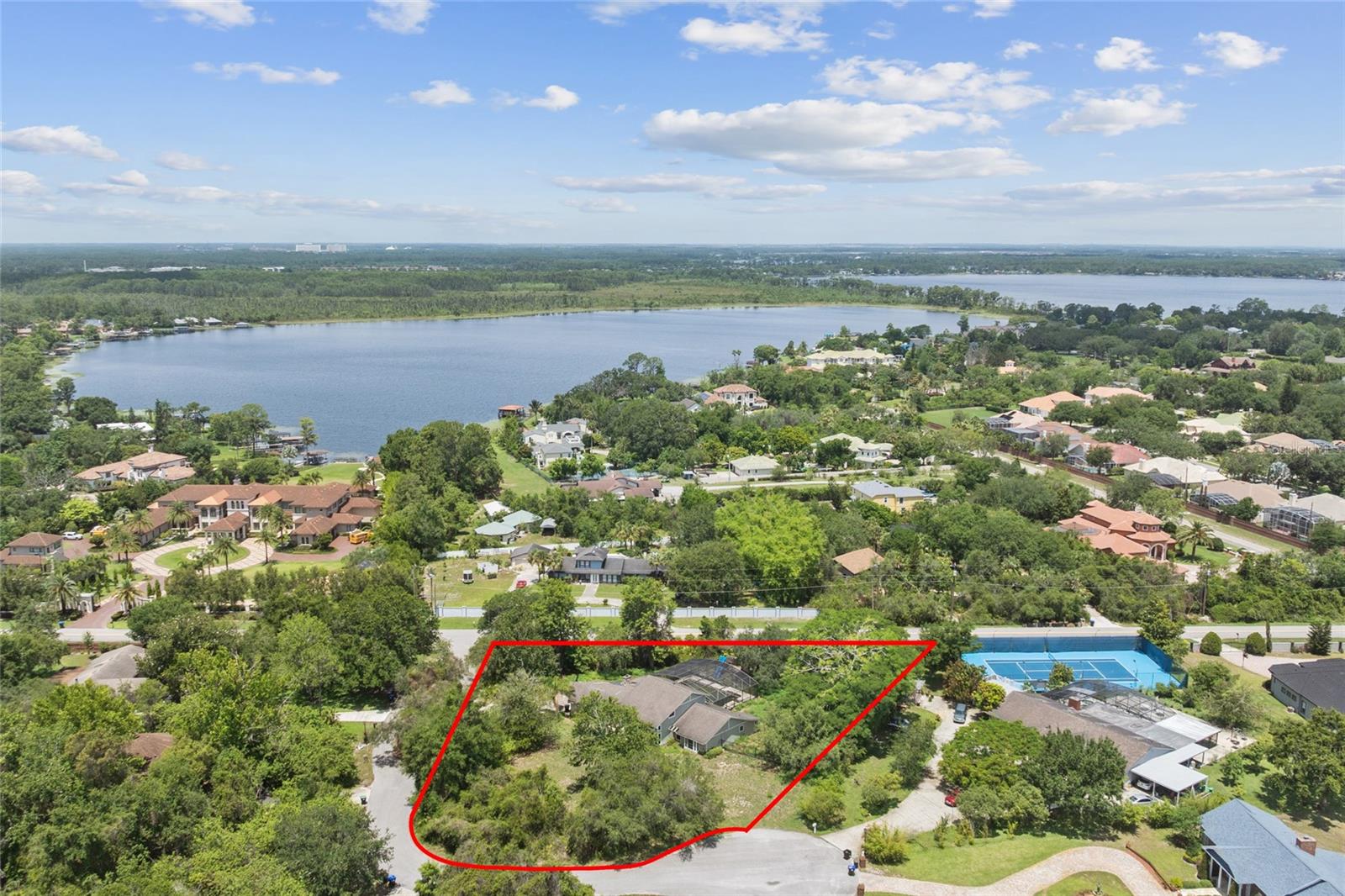 Discover the perfect opportunity to build your luxurious dream home in the highly sought-after neighborhood of Dr. Phillips. This prime 1-acre lot, located just off Apopka Vineland Road, offers over 200 feet of frontage in a serene and prestigious neighborhood. Surrounded by multimillion-dollar estates, this exclusive lot is a rare find, with no other vacant parcels available within a three-mile radius, it stands undefeated in size and price.
Though the existing structure is usable and can be shown, this listing is truly about the land — priced at a value below the cost of land alone, making it an exceptional investment. The neighborhood's average property value exceeds 2 million dollars, this opportunity presents a significantly favorable price point.
City water is available, you'll only need to install a new septic system. Additionally with a current structure in place you will save a significant amount in impact fees when you begin construction. The current structure is about 3300 sqft. This lot can comfortably accomodate a home twice that size. With no HOA restrictions, you can truly let your imagination run wild.
Seize this chance to create your custom haven in one of Orlando's most desirable neighborhoods. Schedule your appointment today and turn your vision of living in Dr. Phillips into a reality!