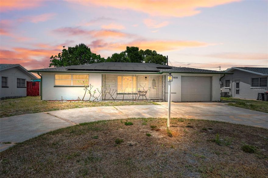 Welcome to this move-in ready 2-bedroom, 2-bathroom home with a 1-car garage in the heart of Port Richey, where comfort, efficiency, and everyday convenience come together. Inside, you’ll find a clean, well-maintained layout with generously sized bedrooms featuring walk-in closets, laminate flooring, and new ceiling fans, while the main bedroom offers a fully renovated bathroom that feels fresh and modern. The kitchen is truly turnkey with brand new appliances including a refrigerator, oven, and dishwasher, and major updates like plumbing replaced with new PVC provide peace of mind. A standout feature is the solar system, which will be completely paid off by the seller at closing, giving you immediate energy savings without added expense. The spacious yard offers plenty of room to relax or create your own outdoor retreat, all while being just minutes from US-19, shopping, dining, and the Gulf coastline. Whether you’re a first-time buyer, downsizing, or investing, this home delivers a rare combination of upgrades, value, and location that’s hard to find at this price point.