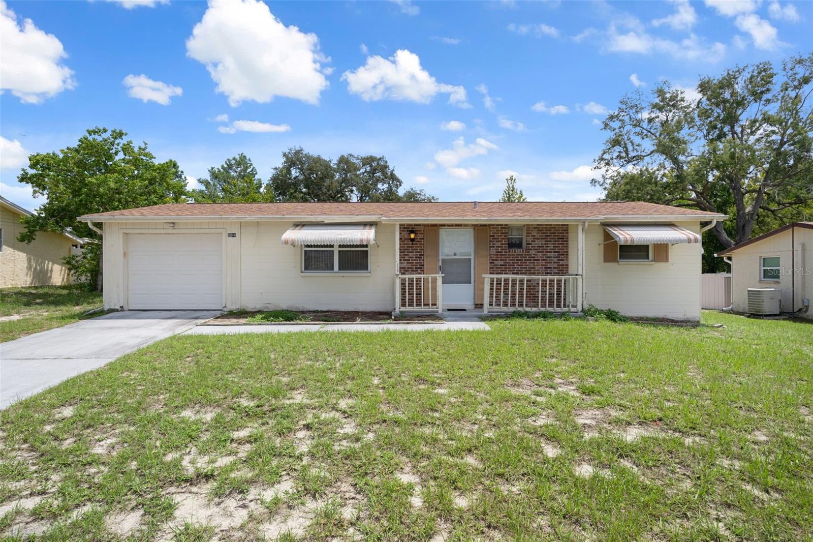 This home features a Spacious Family Room w/ Closet OR use possibly as a 3rd Bedroom. ROOF 9/2021. AC 8/2025 Spacious Open Living / Dining Room with laminate floor and Primary Bedroom w/ private 1/2 Bath. Additional Full Bath, Galley Kitchen, Inside Laundry, Garage and an attached Storage Room complete this home. Outside features a Concrete Patio and Hurricane shutters which are great for weather or to close up the house if you are seasonal. Located conveniently to Shopping, Restaurants, Gulf Coast & Pine Island Beach, Bowling, Movie Theaters and more!