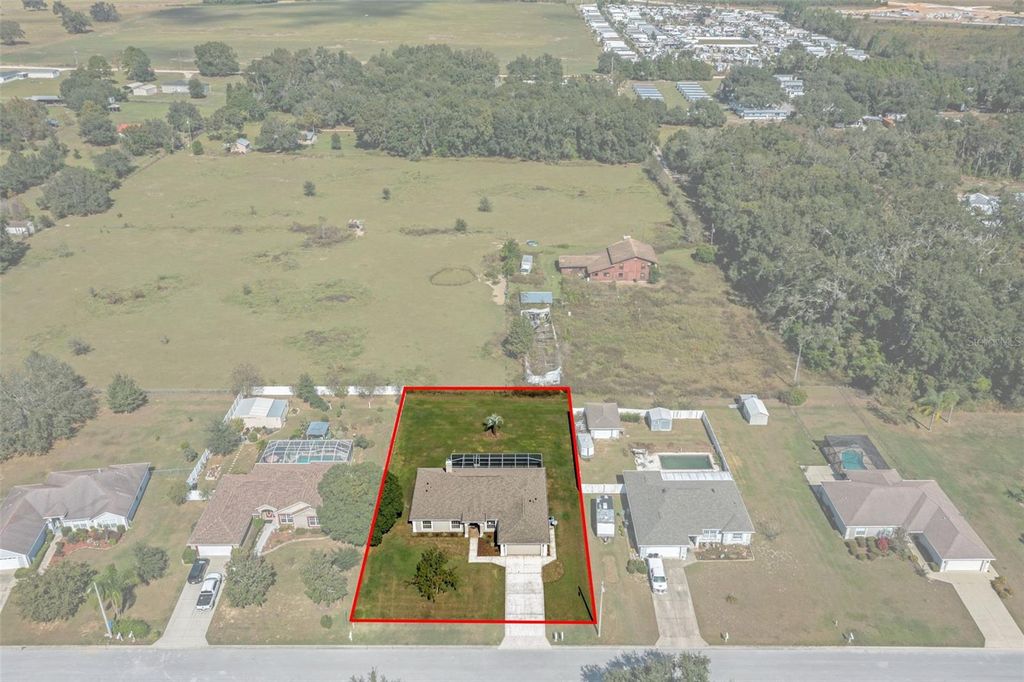 Photo of 10248 Dusty Hill Loop, Dade City, FL 33525 (MLS # W7880494)